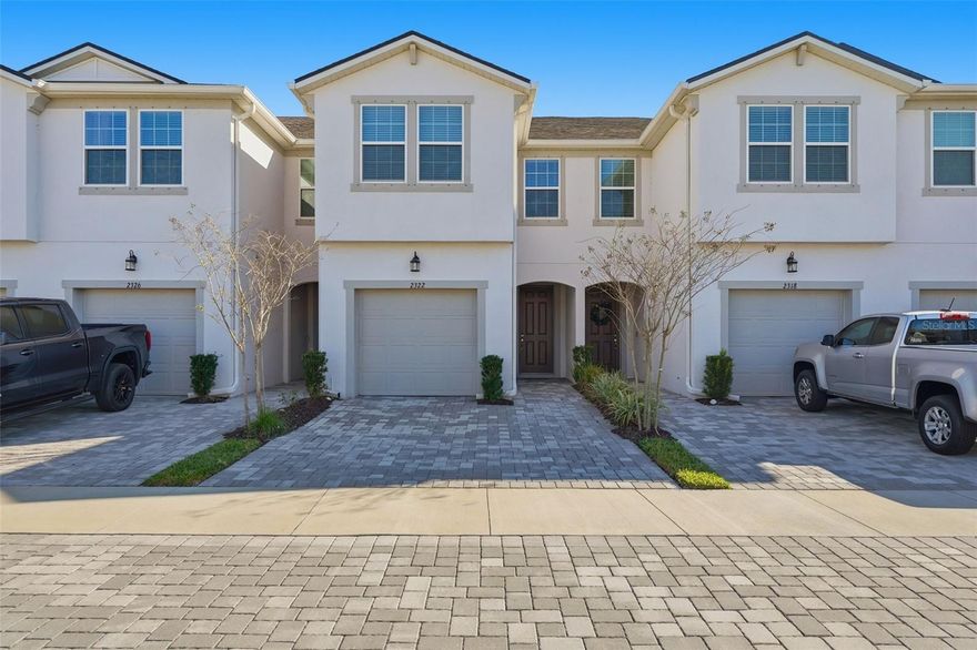 This beautifully designed Marianna townhome offers 1,667 square feet of well-planned living space with an open and spacious layout ideal for modern living. Featuring a West Indies–inspired exterior, the home delivers strong curb appeal with a clean, coastal aesthetic.
Inside, the home is finished with L2 Frost White quartz countertops throughout, perfectly complementing the upgraded Level 3 Tahoe painted Harbor cabinetry. The main living area on the first floor is finished with Level 1 17x17 ceramic tile in a 50x50 brickset pattern, providing both durability and style.
The floor plan includes three bedrooms, two and a half bathrooms, and a single-car garage, along with ample storage throughout. A two-car-wide paver driveway offers additional guest or secondary parking. The screened and pavered lanai creates an inviting outdoor living space with peaceful views.
Upstairs, a versatile second-floor loft provides flexible space suitable for a home office, media area, or additional living space. All bedrooms feature generous closet storage, while the owner’s suite includes multiple closets and a spacious walk-in closet.
Additional highlights include a walk-in pantry, an oversized one-car garage, and an included Smart Home Technology package, adding both convenience and efficiency to this well-appointed townhome.