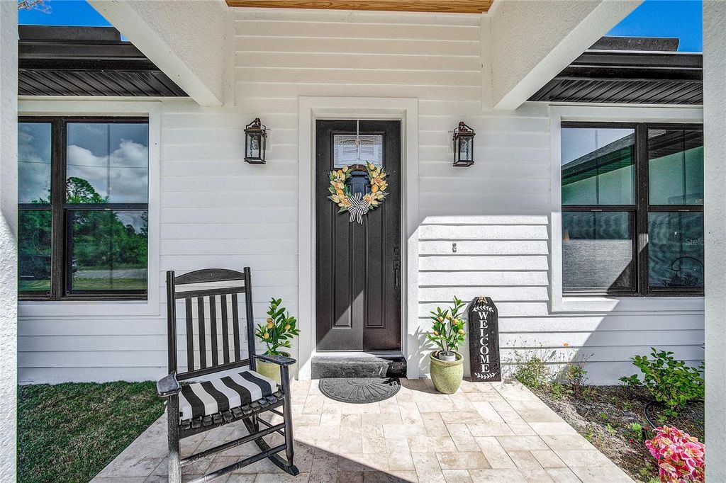Photo of 12078 Chapman Ave, Port Charlotte, FL 33953 (MLS # N6143362)