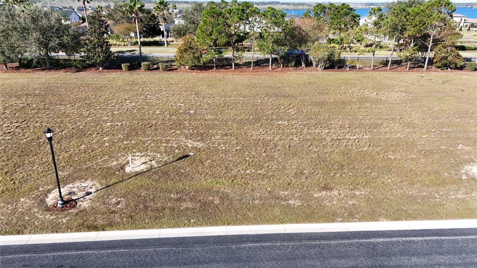 Build your ideal home on this spacious lot in the Water Ridge gated community. Amenities include a clubhouse, three swimming pools, tennis and pickle ball courts, boat ramp, RV and boat storage, and more. Close to shopping and dining, while also providing access to multiple lakes.