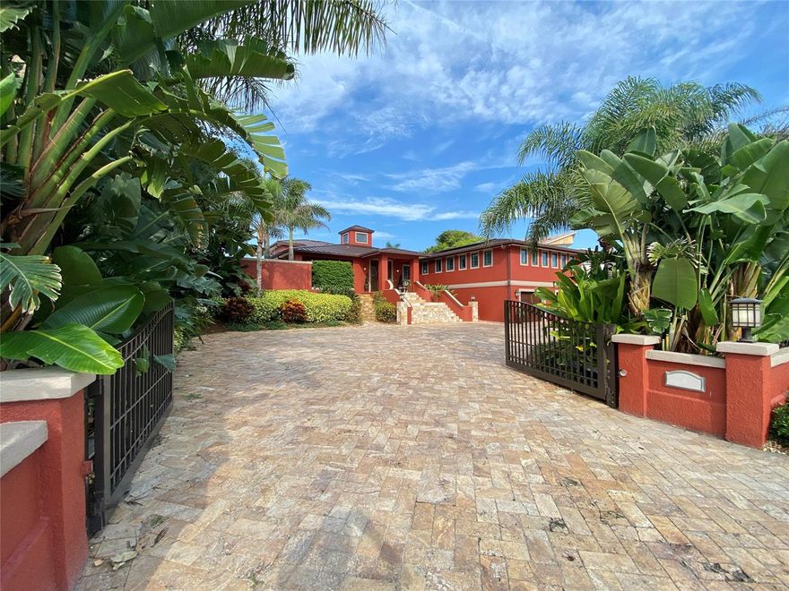 This is the home most people only dream of, capturing the best of New Smyrna Beach in one luxurious package. And the location is second to none, encompassing 110’ of intracoastal frontage on almost a half-acre of prime North Beach real estate. Deep water dockage and no bridges to the Atlantic Ocean, approx 5 minutes to Ponce Inlet. Enjoy endless panoramic views of the river, estuary, sunsets, causeway bridges, light house, Disappearing Island, boat parades, dolphins and wildlife. You’re also just a 5-minute walk to the beach walkover! North Beach offers quick access (via golf cart, bike or on foot) to famous Flagler Avenue for shopping, both casual and fine dining, and an assortment of entertainment including live music, art shows, parades and night life. This 10,000 SF (7,439 living area) 5BR/7BA (5 full, 2 half) estate home exudes class and sophistication while observing the desire to enjoy the good life!  Home features include a riverfront courtyard with saltwater pool and spillover spa, sailfish fountains, 2 outdoor bars, gas fire pit and tiki torches, seawall, covered dock with lift, world-class fishing, tropical multi-level landscaping, perimeter privacy walls, new full-home generator, solar panels and tankless gas water heater.  All bedrooms adorned with en suite baths. There’s also a double-gated paver driveway and motor court, an oversized garage with AC fit for your exotics, multiple balconies, 2 fireplaces, chef’s kitchen, full apartment suite with 2nd full kitchen, movie projection & roll-down screen, fitness room, game room, smart home with A/V security, storm-rated windows & sliders and so much more! This home is sure to captivate the most discerning of tastes and provide new owners with a lifestyle that is second to none. Make sure to watch the studio-quality video tour for a glimpse into this rare offering. ALL INFORMATION ASSUMED ACCURATE BUT NOT GUARANTEED. MEASUREMENTS ARE APPROXIMATE.  BUYERS AND THEIR AGENTS TO VERIFY ALL INFORMATION. ;Water: City