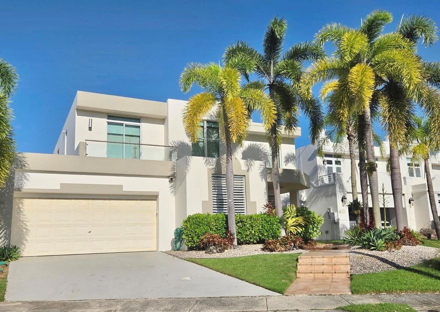 This remarkable property is ideal for family gatherings and entertainment. Nestled in the exclusive Montehiedra community this residence offers 2,200 sq mt of living area and sits on a 844 square meter lot. Upon entering, you are greeted by seamlessly area connecting the living, dining, family, and kitchen areas – creating an inviting atmosphere for both everyday living and entertaining. The kitchen is designed to cater to culinary enthusiasts, with granite countertop, SS appliances and spacious pantry area. This home boasts 4 bedrooms and 3.5 bathrooms. the Master bedroom includes a walk-in closet and ensuite bathroom. Each bedroom is generously sized, offering flexibility for gym, home office, or guest space.Step outside to discover and fall in love with the best of the house: an extra-large serene oasis. Whether you're dreaming of weekend barbecues, a play area, or simply relaxing, this outdoor space offers endless potential for enjoyment and expansion. Generator. Gated community with 24/7 Security, Club House, with a Resort style Swimming pool, and much more. Conveniently located close to essential amenities such as shopping centers, private schools, and dining options. Available for sale $1,495,000. Schedule your visit!