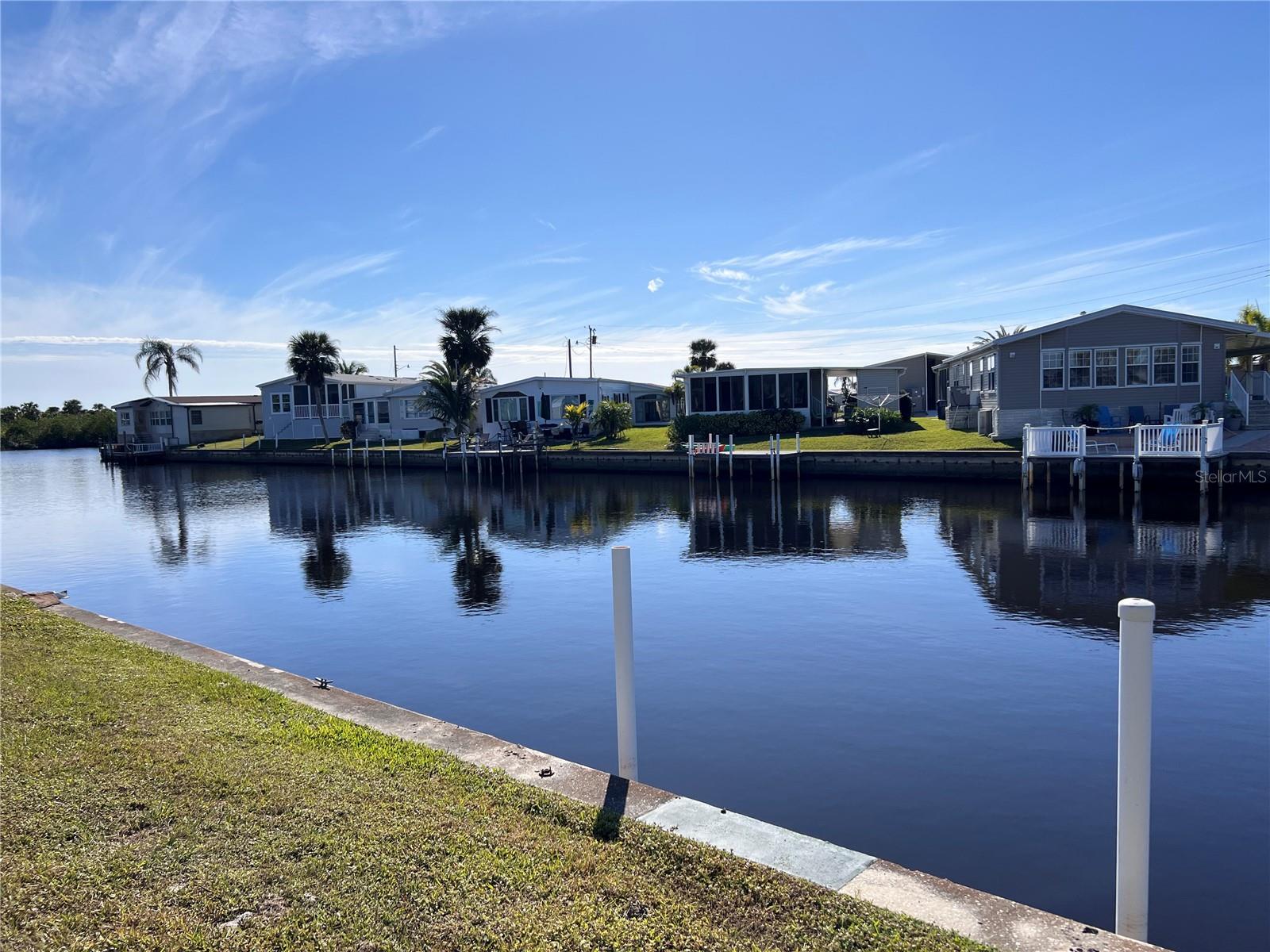 We are live in the auction! You can get a great deal now…. Check it out
Motivated seller- all reasonable offers considered
Vacant Waterfront Lot for Sale – Build Your Dream Florida Home Discover this vacant waterfront lot on a 99-year lease, perfect for creating your ideal Florida home. The leased fee is only $99/ year for remainder of 99 year lease. Additional community amenities are available for an extra fee. Located in Harbor Cove, a premier home resident-owned community, this property offers direct access to the scenic Myakka River, leading to beautiful Charlotte Harbor. Nestled between Sarasota and Fort Myers in North Port, Florida. This 190-acre community is teeming with wildlife such as herons, egrets, cranes, ibis, parrots, manatees, and even alligators. Enjoy peaceful walks through the lush landscape or participate in the vibrant community life. Harbor Cove Amenities Include: • 90-slip marina at the 17,000-square-foot activity center • Two heated pools and a hot tub • Tennis, pickleball, shuffleboard, bocce, and horseshoe courts • Fitness classes, water aerobics, and woodworking • Social activities: golf cart parades, dances, bingo, craft workshops, picnics, and more • Clubs for boating, golf, bowling, and other hobbies Harbor Cove is truly a boater’s paradise and an active, fun-filled community designed for those who love to relax and engage with others. Don’t miss this opportunity to create your dream home in this serene and lively waterfront community!
All info, measurements, and details are assumed reliable, but not guaranteed. Buyers agent and buyer are responsible to confirm.