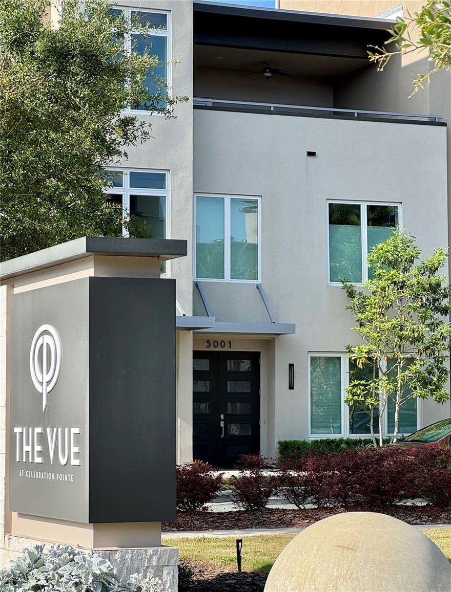 One-of-a-kind Luxury townhome in Celebration Pointe. This spacious 2000+ square foot home provides a shaded north-facing rooftop terrace off the third floor Primary Bedroom Suite. After you enter the town home from the private 2-car garage, you can pass by the laundry room and guest suite to take the stairs, or just hop on your elevator! The main living area is on the second floor, offering plenty of natural light, solid-wood sleek cabinets, and guest bathroom. The VUE at Celebration Pointe is proximate to dining, entertainment, transportation, and has a beautiful VUE pool, spa, and cabana. In addition, The relatively low HOA fee covers 24-hour security patrol, exterior maintenance & insurance, interior pest control, and will have entry and exit gates. Experience some nature with your urban-living: the entire west side of The VUE at Celebration Pointe abuts the 700-acre Kanapaha Nature Preserve, so you are likely to see Sandhill Cranes and deer off of the pool deck. Schedule a showing to see this remarkable low-maintenance lifestyle home.