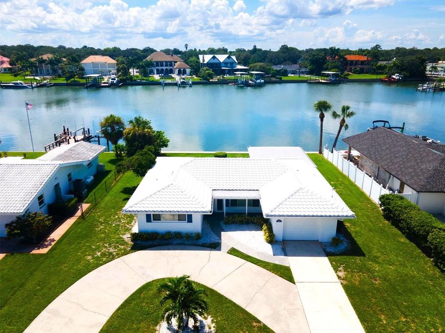 BEAUTIFULLY UPDATED ISLAND WATEFRONT HOME WITH STUNNING WATER VIEWS! Amazing Home in one of Largo's most notable waterfront neighborhoods - now available for long term lease. Move right in to this updated, light and bright home which offers 2 bedrooms, 2 baths and one car garage with a circular driveway. The water views are sure to blow you away and make you want to call this wonderful place your home. Inside you will discover a welcoming and open floor plan with separate living and family rooms with multiple large windows displaying the sparkling water views. The kitchen is beautifully remodeled with stainless steel appliances, shaker style cabinets and stylish granite countertops. The two bathrooms are gorgeous with one being the part of the primary bedroom ensuite. The floors are all LVP with tile in the bathrooms. Enjoy reclining on the rear brick paver lanai while taking in the views of passing boats, dolphins, manatees and all the beautiful tropical birds that come to visit. There is no boat dock but a small boat could possibly be moored at the seawall. Bring your Kayaks, canoes, paddle boards and the like. They can all be launched from here. There are several uninhabited islands to visit and explore or just fish from your seawall and catch yourself some dinner. There is a public boat launch just a few minutes away. The opportunities to enjoy this home abound. The gulf beaches are just 5 minutes away. Shopping malls, boutique stores, entertainment, golf courses, marinas, parks, lakes and so much more are all nearby. Tampa & Clearwater airports are just 30-40 minutes away. Homes for rent in this luxurious community are rare so don't miss out! Credit and background checks and a one year minimum lease are required. 1-2 pets are negotiable. Schedule your tour today!