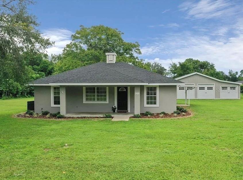 Welcome to your private retreat located just between Ocala and the quite town of Anthony, Fl. Nestled on a spacious one acre lot, this beautifully updated home offers the perfect blend of country living and city convenience—still close to shopping, dining, and more.
Step inside to find brand new flooring through out, freshly painted from top to bottom, and stylish new fixtures replaced in the entire home. The split-bedroom floor plan provides both privacy and comfort, with the primary suite featuring a walk-in closet and is complete with a walk-in shower and dual shower heads. On the other side of the home you'll find two cozy guest bedrooms and a guest bathroom. The bright kitchen boasts an abundant of cabinets, generous counter space, and a large window flooding the room with natural light. An inside laundry room already equipped with washer, dryer, sink, and extra storage adds everyday convenience.
Outside is where this property truly shines-Featuring a newer roof (2023), freshly landscaped grounds and new exterior paint. And for added peace of mind, the property comes equipped with a whole-home generator, ensuring comfort and security during any power outage. This property keeps getting better.. on your spacious acre of land you'll find a HUGE 1,200 sqft detached garage/workshop with electric and concrete slab. This space is perfect for those seeking extra room to store their vehicles, boats, tools, and work on all your weekend projects. With plenty of room to spread out, relax, and enjoy the quiet country setting, this home is a rare find.