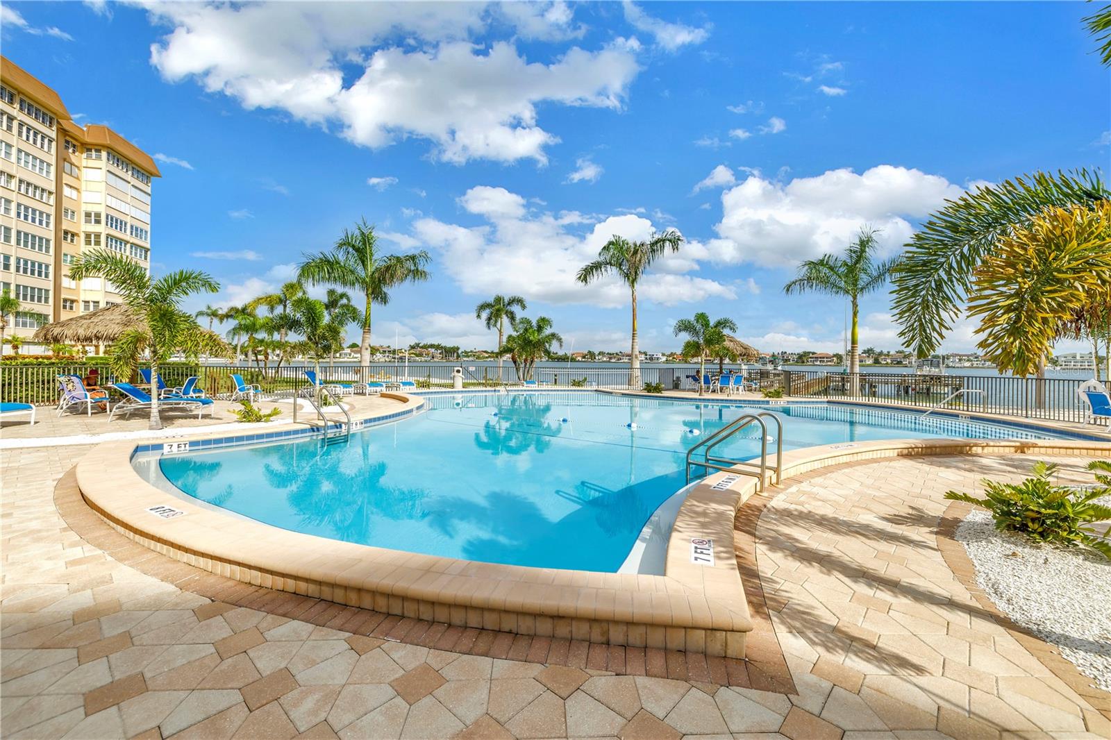 THIS IS TRULY FLORIDA LIVING AT ITS BEST!! Welcome to Point Brittany, a beautifully maintained waterfront 55+ community located in gorgeous St Petersburg, Florida. This spacious, RENOVATED 2 bedroom, 2 bathroom condo with large BONUS/DEN/OFFICE/STUDIO overlooks the Boca Ciega Bay with spectacular views of the iconic Sunshine Skyway bridge. Located on the 5th floor, this unit has it all – an updated kitchen with stainless steel appliances, designer countertops & backsplash, updated bathrooms, newer AC (2022), double pane impact glass windows, automatic hurricane shutters, inside washer & dryer, walk-in closets, two storage units just down the hall and one very conveniently located covered parking space (parking space #2). Whether you’re in the kitchen or lounging on the sofa, you’ll love glancing over and seeing the Skyway bridge, especially in the evening when it’s all lit up. The Point Brittany community has so much to offer you’ll feel like you’re living at a resort. There is over 2,000 feet of seawall (recently replaced & paid for), four heated pools, a spa, fitness center, tennis & pickleball courts, a clubhouse, ballroom, craft room, billiards, ping-pong table, card room, library, meeting rooms, fishing piers, kayak storage, first come, first serve boat slips, barbecue areas, a fire pit, waterfront pavilion and gazebo, on-site management office, on-site medical office, hair salon and the convenient Bayway Country Store. The community is fully gated with 24-hour security. Water, sewer, trash, cable & internet are included in the HOA. There is a full-size washer & dryer on each floor available for residents. MAKE AN APPOINTMENT TODAY TO SEE THIS AMAZING PROPERTY!