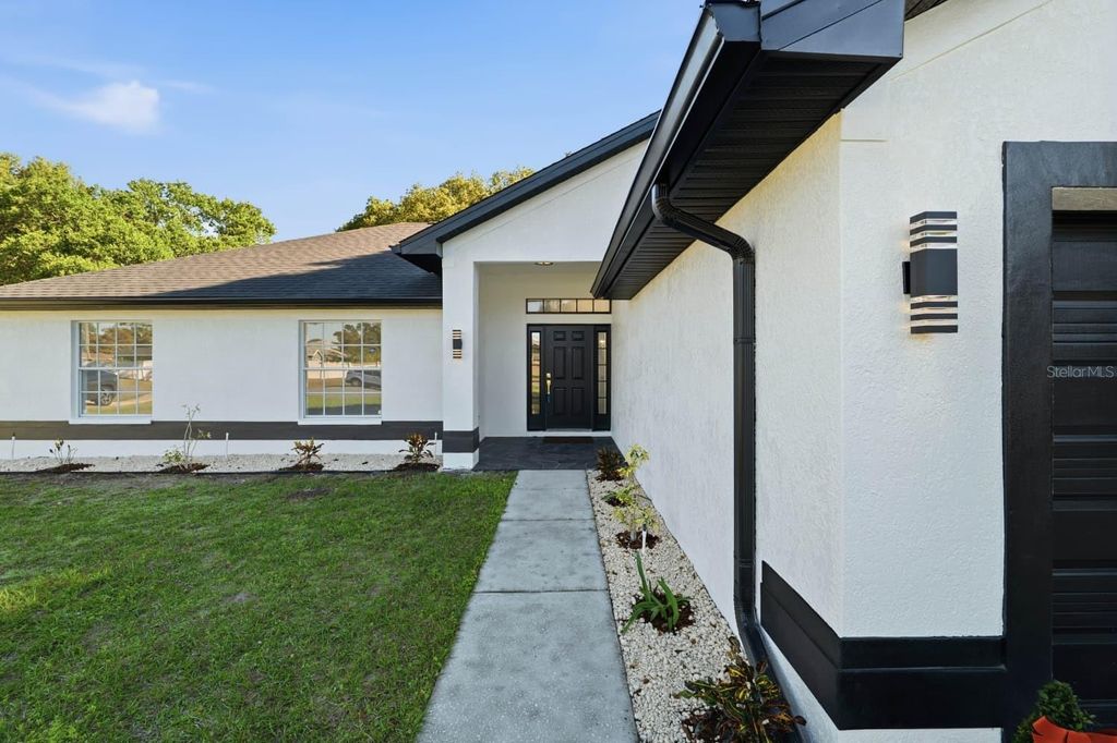 Photo of 3180 Wiltshire Avenue, Spring Hill, FL 34608 (MLS # TB8448211)