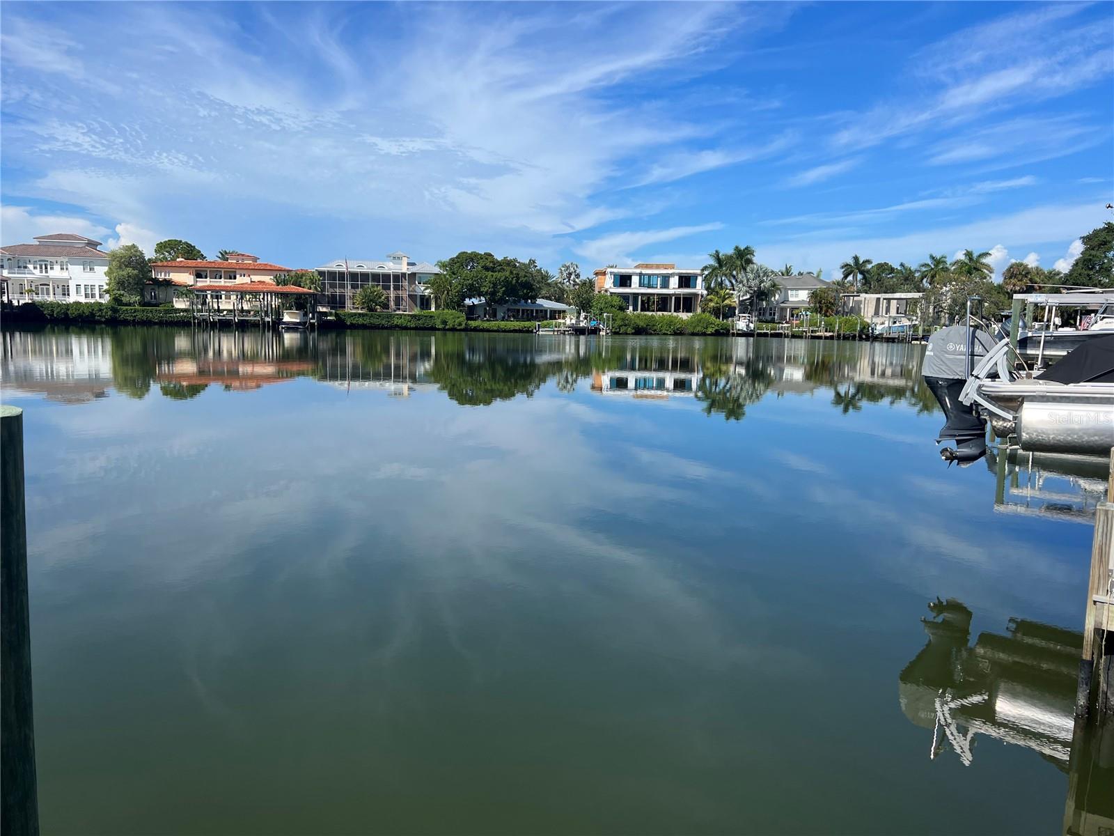 Land only - Pick you own builder! Imagine living in your dream home on this prime waterfront lot on the beautiful Pirates Cove, with direct access to the open bay. The City has already approved all the permits, so you can start building right away. The lot is cleared and ready for construction. It’s located in the desirable Westshore-Kennedy area, close to the Westshore Business District, Tampa International Airport, and downtown Tampa. You’ll also find plenty of fine dining and luxury shopping nearby. And if you’re looking for some beach time, it’s just a 30-minute drive to the Gulf Beaches.