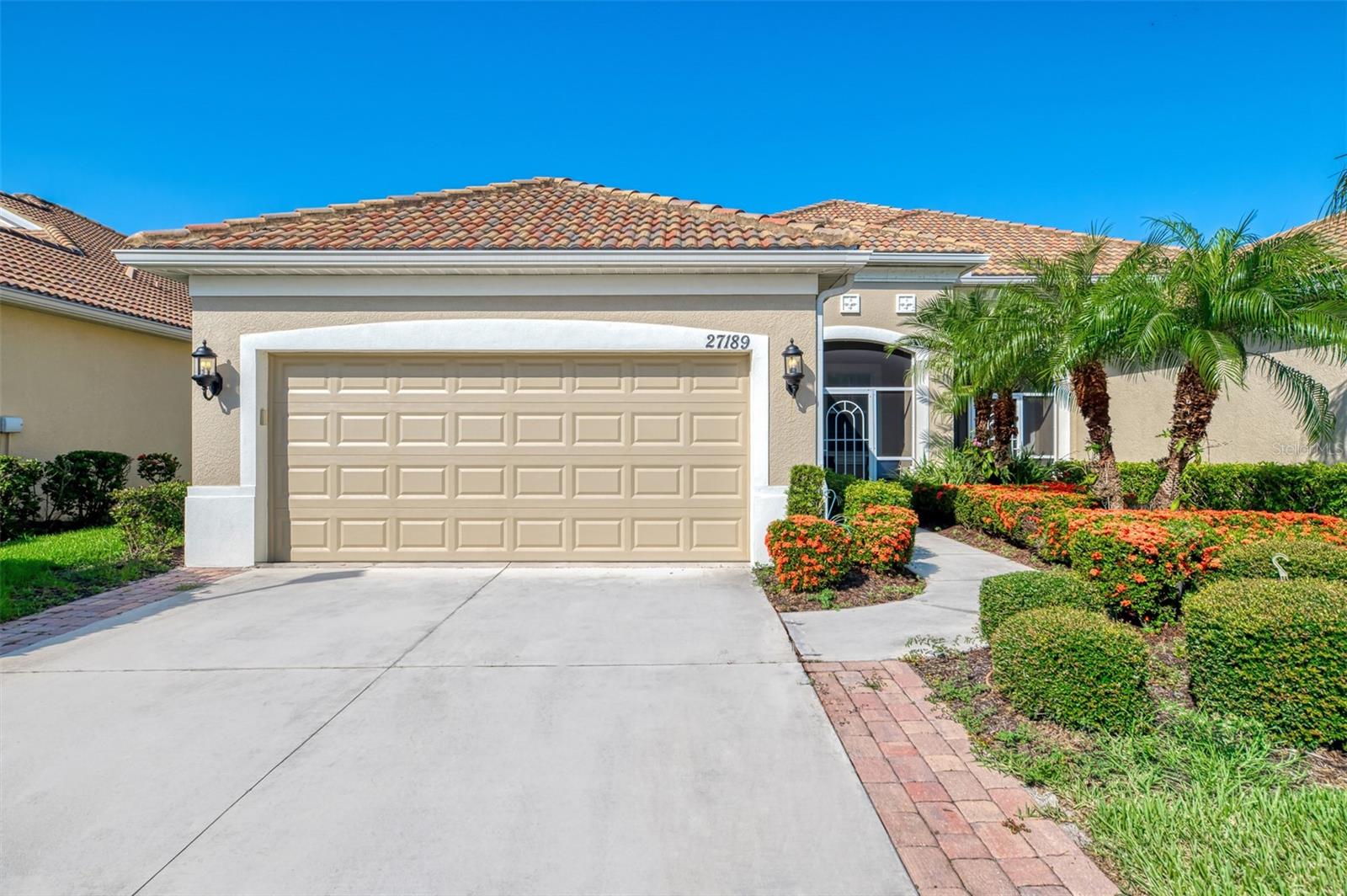 Welcome to your coastal retreat that perfectly blends comfort, style, and convenience. This beautifully maintained, move-in-ready villa is tucked inside the sought-after Arlington Cove community, just minutes from beautiful Manasota Beach. Step inside and discover an inviting open-concept design featuring two spacious bedrooms, two full bathrooms, and a versatile den. Sleek tile flooring flows throughout the home, lending a modern touch and low-maintenance living. The kitchen is a true showstopper, showcasing gleaming quartz countertops, a generous island, and a convenient breakfast bar that invites conversation and cozy mornings alike. The primary suite features a large walk-in closet and an elegant en-suite bath complete with double vanities and a walk-in shower. A set of French doors leads to the den, offering the perfect space for a home office, studio, or occasional guest room. Step out to the screened lanai and enjoy the warm Florida breeze while grilling or relaxing in your own piece of paradise. 2 car garage with utility sink. Arlington Cove takes the hassle out of homeownership with included lawn maintenance and a heated community pool to enjoy year-round. With quick access to Manasota Beach, downtown Venice, shopping, and dining, this villa delivers the best of coastal Florida living. Don’t miss your chance to make it yours. Schedule your private showing today!