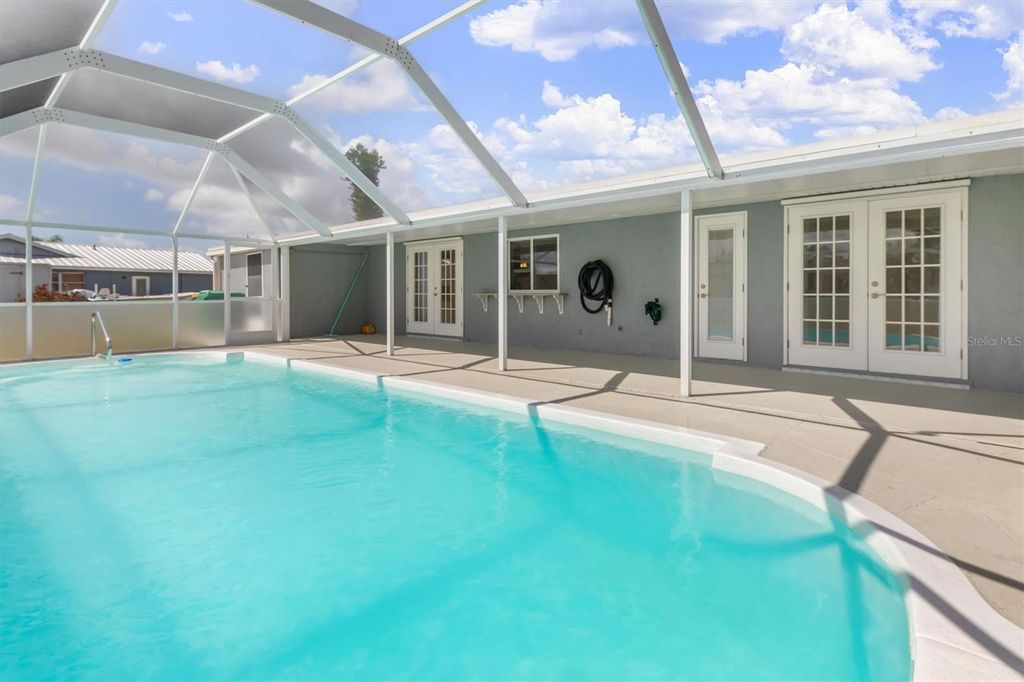 Photo of 703 Spring Lake Boulevard NW, Port Charlotte, FL 33952 (MLS # C7515906)