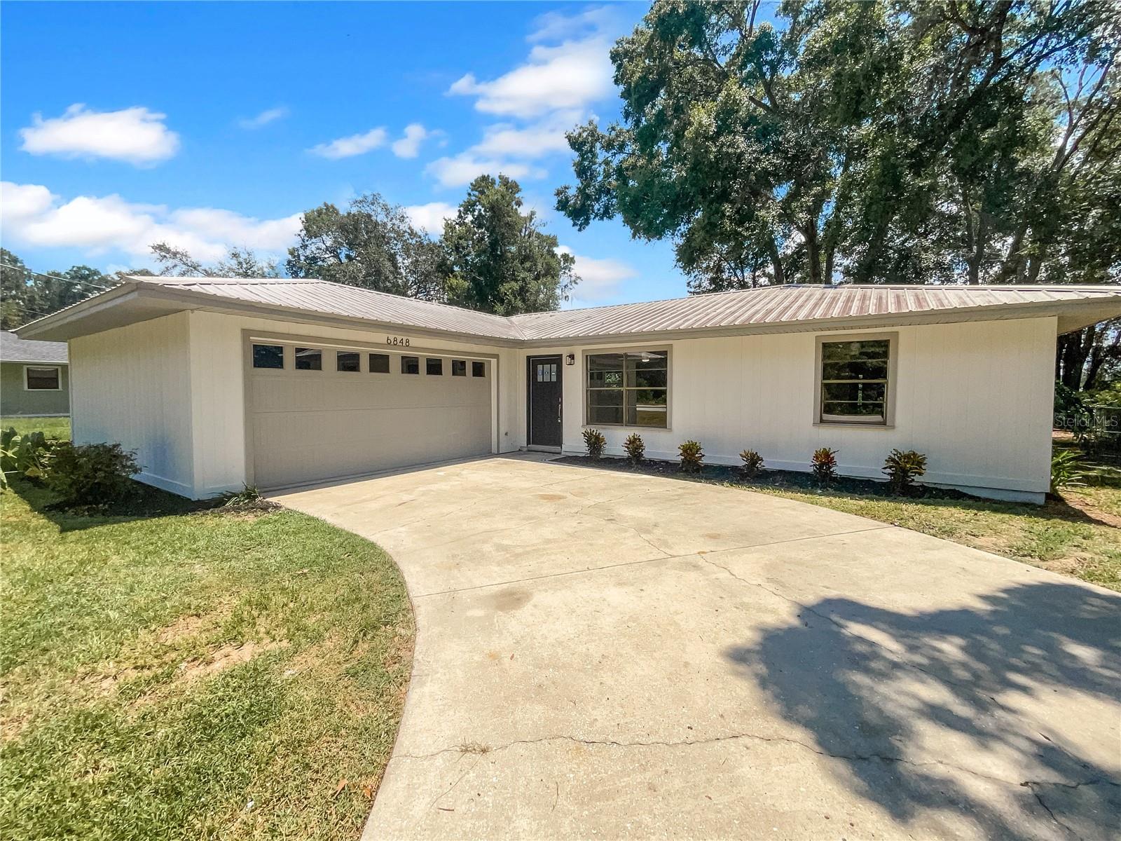One or more photo(s) has been virtually staged. Welcome home to this beautifully renovated home in a great area! Discover a bright interior tied together with a neutral color palette boasting fresh paint and new flooring. The remodeled kitchen is a chef's dream featuring new cabinets, stone counter tops and stainless steel appliances. Head to the spacious primary suite with good layout and closet included. The primary bathroom has plenty of under sink storage waiting for your home organization needs and new shower. Take it easy in the fenced in back yard. The sitting area makes it great for BBQs! Hurry, this won’t last long!. 100-Day Home Warranty coverage available at closing