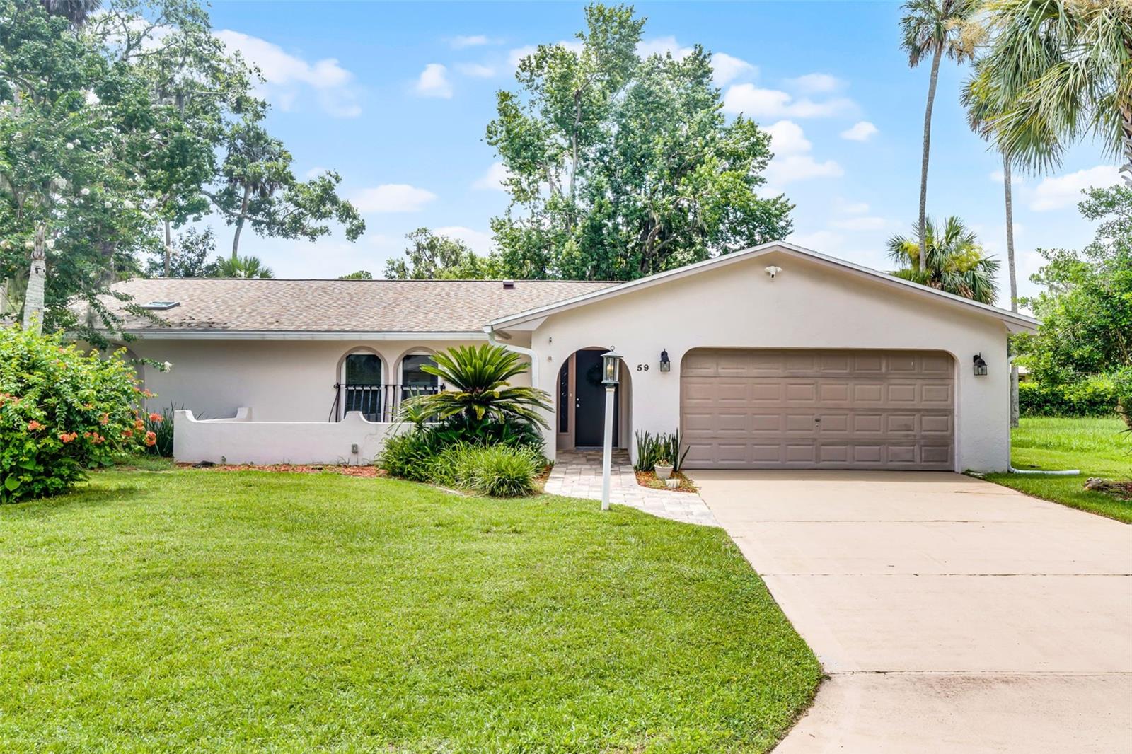 Unbeatable Value in a Beautifully Updated 4-Bedroom Block Home - Large Lot, Prime Location, and Exceptional Upgrades! Located in one of Palm Coast's most desirable ''hidden'' neighborhoods, this updated block home offers the best value for the price. Situated on a spacious lot, the property provides both privacy and room for outdoor activities. With great curb appeal and a cozy courtyard at the front, the home welcomes you into a foyer leading to the large living room and dining area. The kitchen is updated with granite countertops and new appliances, and the bathrooms have been beautifully renovated. The well-designed split floor plan features a primary suite with an ensuite bath and walk-in closet, while three additional oversized bedrooms share a guest bath. A separate utility mudroom off the oversized 2-car garage adds convenience. The expansive, covered, and screened lanai is perfect for family gatherings and relaxation, offering additional living space. The private, fenced yard is a tranquil oasis with a brick patio ideal for barbecuing. Recent updates include: Roof 2024, 2 Skylights 2024, Roof Solar Fan 2024, HVAC system 2024, Water Heater 5/2022, updated electrical outlets house, garage, lanai & ceiling fans installed in rooms, 2022, vinyl fence 2022, yard resodded 2022, gutters and guards 2022, impact windows (8) 11/2022, and an air filter system 2023. Great location and just minutes from shopping, dining, and the beach, this home offers unbeatable value in today's market. Don't miss your chance to see it for yourself - schedule a showing today!