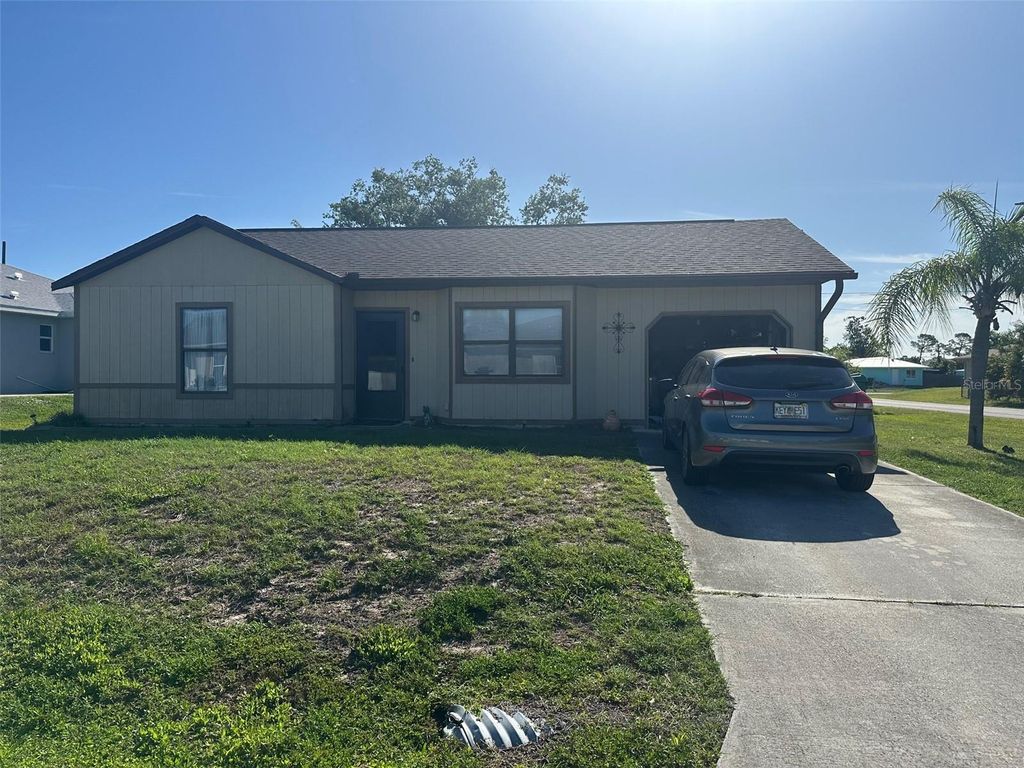 Photo of 807 Haleybury Street, Port Charlotte, FL 33948 (MLS # C7525666)