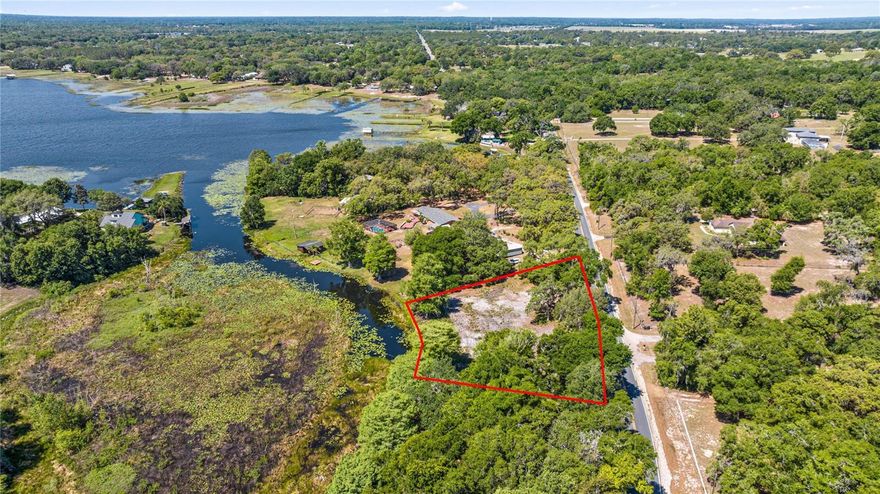 Waterfront canal lot with direct access to the private, spring fed 352 acre Smith Lake - perfect for boating, fishing and water sports. This cleared property offers 264 feet of deep water frontage, a 30-foot aluminum seawall by Labaugh Marine, and beautiful west facing lake views. A valuable variance allows building just 25 feet from the water's edge. With over an acre of buildable space, there's plenty of room for your home and additional structures. Quick and easy access to Smith Lake a few hundred feet away. The only waterfront lot currently available on Smith Lake! Owner will finance with $50,000 down.
