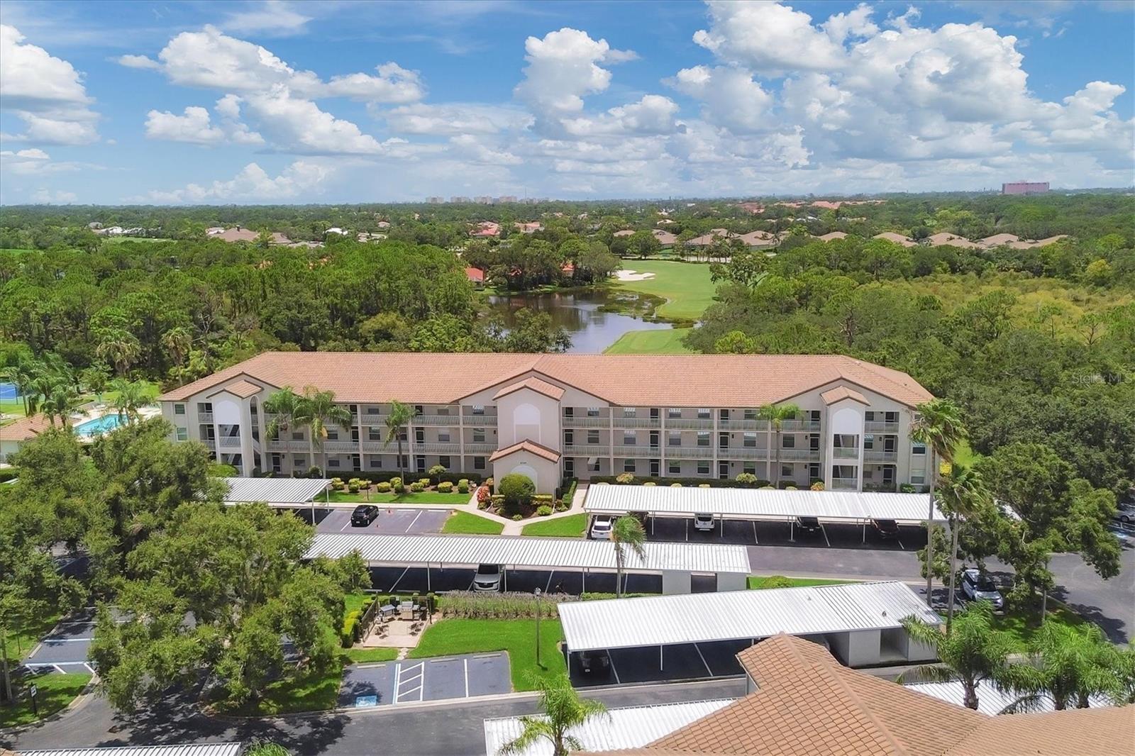 Enjoy breathtaking sunset views over the pond and 9th tee box from this beautifully maintained
2-bedroom, 2-bath condo, surrounded by swaying palms and majestic live oaks. The split
floorplan offers privacy and comfort, with a spacious primary suite featuring golf course views,
sliding doors to the lanai, two closets—including a custom walk-in—and a large ensuite bath
with a separate shower and water closet.
The kitchen is updated with solid wood cabinetry, granite countertops, and neutral tile flooring.
It opens seamlessly to the dining and living areas, flowing into the glass-enclosed lanai—ideal
for entertaining or relaxing with morning coffee or evening sunsets.
A guest bedroom with a Murphy bed and nearby full bath adds flexibility for visitors. Additional
features include a carport and private storage closet.
Located in the sought-after Terraces community of Stoneybrook Golf & Country Club, residents
enjoy a resort-style pool, grilling area, and tennis/pickleball courts. Your membership includes
access to the newly modernized golf course, Har-Tru tennis courts, bocce, fitness center, and
clubhouse dining. Just minutes from the Legacy Trail and the beaches of Siesta Key and
Nokomis, this is Florida living at its best.
Why settle for a condo when you can own a lifestyle? Call today to schedule your private tour—
Nowhere but here, Stoneybrook Golf & Country Club.