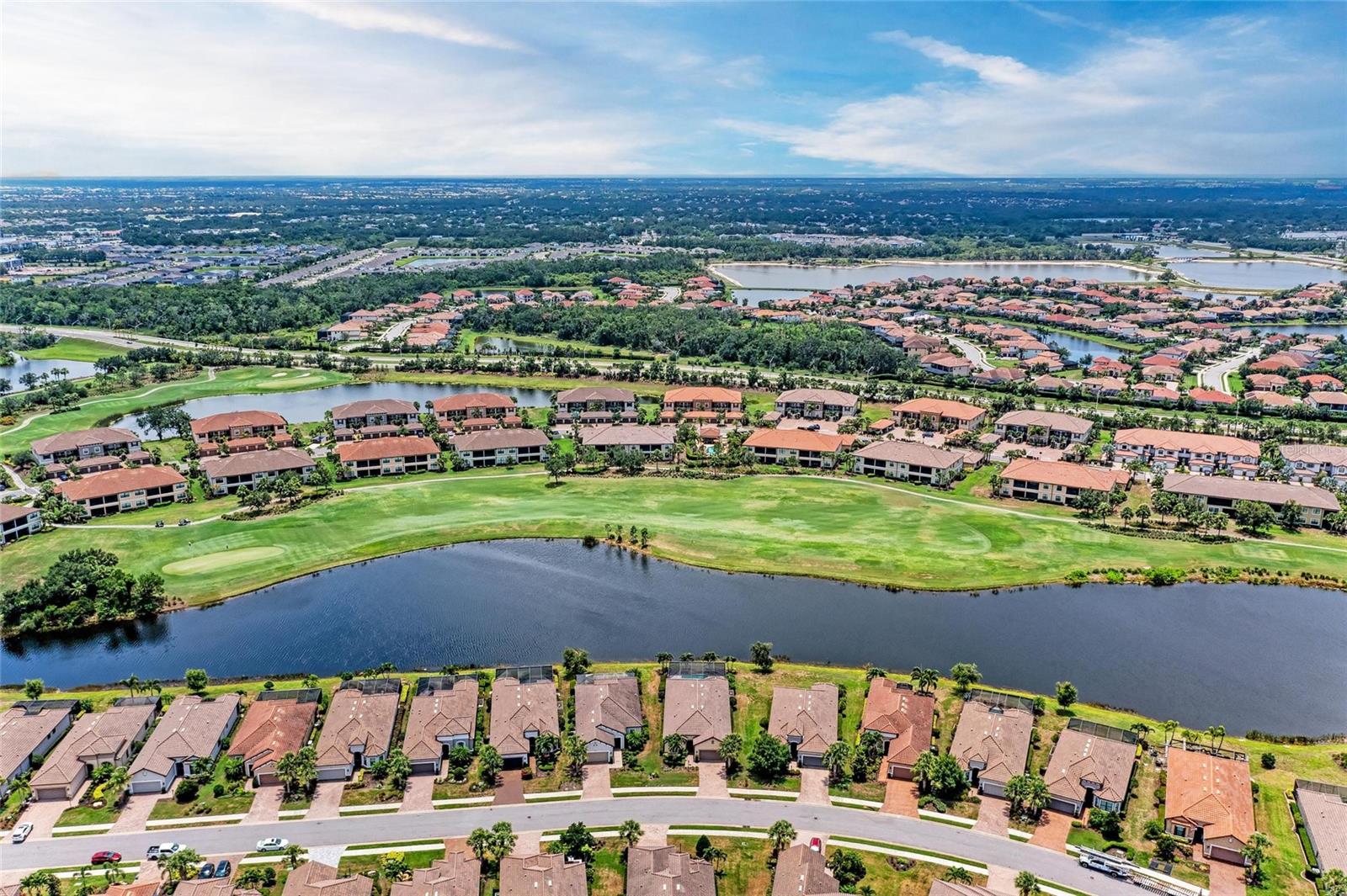 Enjoy the ultimate Florida lifestyle in this beautifully Furnished First-floor condo located in the highly desirable Esplanade Golf & Country Club at Lakewood Ranch. This move-in-ready home includes a FULL GOLF MEMBERSHIP, offering exclusive access to one of the area’s premier golf communities. Step onto your screened-in lanai and take in serene views of the 3rd hole, surrounded by lush, tropical landscaping. Inside, the bright and spacious open-concept floor plan features a kitchen outfitted with granite countertops, stainless steel appliances, a generous pantry, and 42” solid wood cabinetry—perfect for cooking and entertaining. Adjacent to the dining area is a versatile study or home office, ideal for remote work or quiet reading. The living room offers thoughtful details including crown molding, recessed lighting, a ceiling fan, and triple sliding glass doors that seamlessly blend indoor and outdoor living. The primary suite provides a peaceful retreat with two walk-in closets and an elegant ensuite bathroom featuring a dual-sink vanity and a walk-in shower. The second bedroom is privately located near the front of the home, next to a full guest bath and a laundry area equipped with a washer and dryer. Additional perks include a dedicated covered carport and a private storage unit. Living in Esplanade means access to a gated, resort-style community packed with top-tier amenities including: Unlimited golf, Tennis and pickleball courts, Resort pool and spa, Satellite pool, State-of-the-art fitness center with personal training, Fine and casual dining options, including a formal restaurant and Tiki bar, Full-service spa and salon, Social activities, walking trails, and more. Just minutes from top-rated schools including Lakewood Ranch Preparatory Academy, world-class golf courses, dining, shopping, University Town Center, & a short drive to the white-sand beaches, downtown Sarasota, & I-75 for quick access to Tampa, St. Petersburg, & beyond. This gated, maintenance-free, amenity-rich community offers a rare opportunity to enjoy luxury living in the nation’s #1 top master-planned community. Whether you’re seeking refined design, modern upgrades, or the perfect Florida lifestyle, 13711 Messina Loop #102 delivers it all and more.