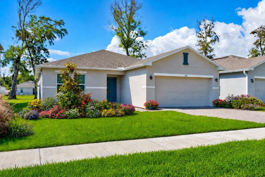 One or more photo(s) has been virtually staged. This is living at Riverfront! Welcome to 176 Jones Fish Camp Road in Edgewater, where newer Taylor Morrison construction, thoughtful design, and relaxed Florida living come together beautifully. Built just two years ago, this move-in ready Ambrosia floor plan offers a smart single-story layout with open living spaces, comfortable bedroom separation, and modern finishes throughout. From the moment you enter, the dining area, great room, and kitchen flow naturally together, creating a bright and functional setting for everyday living, entertaining, or relaxing after a day near the water. The kitchen features a large prep island, walk-in corner pantry, and excellent natural light, while sliding glass doors lead to the insulated panel screened back porch, where tranquil water views, abundant birdlife, and front-row seats to Florida’s breathtaking shuttle launches create a setting that feels truly special. This outdoor space is perfect for grilling with friends, enjoying morning coffee, or simply unwinding at the end of the day. The private primary suite is thoughtfully positioned away from the secondary bedrooms and features a spacious bath with dual sinks, a large shower, generous walk-in closet, and additional linen storage. Practical touches like the laundry room entry add convenience after beach days, boating, fishing, yard work, or outdoor adventures. Furnishings are negotiable, including the electric fireplace in the living room, making this an even easier opportunity for a buyer looking for a turnkey feel. The community adds even more appeal with walkable streets, friendly neighbors, a dog park, an observation pier at the east end of the neighborhood along the river where you can watch dolphins, manatees, and night launches, plus exciting potential for future marina access nearby with a planned beach area and wet/dry boat slips. With the Intracoastal, boat ramps, parks, New Smyrna Beach, shopping, dining, and natural treasures like Merritt Island wildlife areas all within easy reach, this home offers newer construction, water-view lifestyle, and everyday convenience without the wait of building new. Clean, comfortable, and ready to close at a moment’s notice, this is a great opportunity to own a newer Taylor Morrison home in one of Southeast Volusia’s most convenient coastal communities.