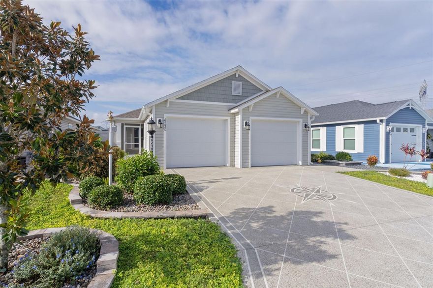 Step into this beautifully maintained  home, perfectly located in the sought-after Village of Citrus Grove (Sumter County)!   Breathtaking water view the moment you walk in.  You'll find a private backyard with no neighbor directly behind you.  There is a screened lanai with electric shades + private patio with retractable electric awning — ideal for indoor/outdoor Florida living.   The spacious primary suite with his & hers walk-in closets .  The primary bath features dual sinks, a luxurious Roman shower, and a private water closet.   Easy-care tile flooring throughout the entire home and a whole-house water filtration system!  The split-unit A/C in the garage is climate-controlled with epoxy floor, perfect for hobbies or storage.  Just a 2-minute walk to Homestead Recreation Center with a pool,(heated during cooler months) pickleball, tennis, billiards, darts, bocce, shuffle board, dog park, astronomy pads, nature trail and more!  This home offers the perfect blend of comfort, privacy, and convenience in one of The Villages' most vibrant neighborhoods.  Don’t miss this rare opportunity to have a water view home! Schedule your private showing today. All measurements are approximate and should be verified.