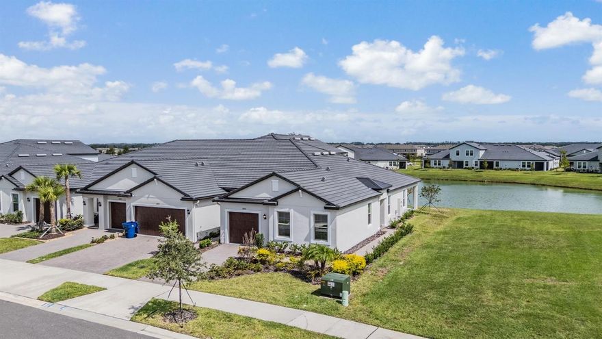 Location, Location, Location! Just steps away from the Clubhouse and Amenity Center! This pristine Pottery Barn inspired Villa with wonderful POND LOT in Medley Active Adult. For those better than 55 years young, presents an exceptional lifestyle just beyond the confines of your home. As a resident, you'll enjoy exclusive Clubhouse access with a full calendar of events daily! You will also enjoy a restaurant & bar, heated pool w/cabanas, ballroom, billiards room, card room, state of the art fitness center, pickleball & tennis courts, bocce ball, yoga, line dancing and private active adult events. PLUS included in your HOA is a 15-acre lagoon membership w/soft, sandy beaches including a swim-up bar, kayaking, paddleboarding, obstacle course, waterslides, corn hole games, and tons of community events! Be sure & invite friends or family to come along with you as you may gift them passes or pay a deeply discounted rate! This immaculate villa will please even the most selective buyers! Comprised of 2 spacious bedrooms, 2 Full Baths + an office/den, and 1 car garage. Your new home includes lots of upgrades including crown molding, quartz countertops throughout, plenty of lighting, stainless appliances and white cabinetry. Sliding glass doors lead to your Lania with a wonderful pond view and extra space between villas. Great spot to sit and relax and enjoy a cup of coffee or glass of wine! As you step inside, you'll be greeted by a seamless flow of open living spaces, making it ideal for both relaxation and entertaining. Get ready to make memories that will last a lifetime! Your dream home awaits; you will be enjoying the CAREFREE FLORIDA RESORT LIFESTYLE in your new home as quickly as you are able to move in! Gorgeous curb appeal on this block villa! Enjoy 42" Cabinets, and Walk-in Pantry in this gorgeous kitchen. Primary Suite includes ensuite bath, dual sinks, and Walk-in Closet to keep you organized, and ceiling fans to keep you cool. High-speed (ULTRAFI) internet, premium cable, yard maintenance & exterior painting and homeowners' insurance for structure are covered by HOA. The location of this residence is equally remarkable, situated in close proximity to premier shopping destinations, and an array of dining options, you'll find yourself immersed in a vibrant community that strikes a perfect balance between exclusivity and convenience. Ride your Golf Cart to the Clubhouse, Publix, restaurants, Farmers Market, Chick-fil-A, Banks, Starbucks, Nail Shops, and more! Close to Advent Health Hospitals, BayCare Hospital, Florida Medical Clinic, Wire Grass Mall, Tampa Premium Outlet Mall, Krate at the Grove, Sam's Club, Costco, Golf Courses & Movie Theater. Easy access to I75, 275, T