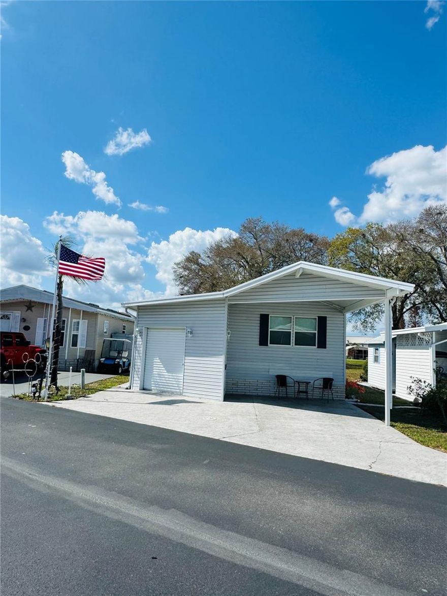 Welcome to DEER CREEK RV GOLF & COUNTRY CLUB!  It’s the perfect time to purchase your new FLORIDA GETAWAY!  Whether you are looking for a sunny place to winter or a full-time residency, this two-bedroom, two bath model is perfect!  Home is TURNKEY, MOVE IN READY & even includes a golf cart!  Located on the 7th fairway of the fabulous Deer Creek Golf Course!  This getaway features a nice 10 x 12 Trex Deck! What a great place for entertaining with family & friends or sipping your morning coffee overlooking the golf course!  Golf Cart Garage is attached with washer/dryer & plenty of storage for your golf clubs & pool toys!  A Deer Creek Certificate is also included in the sale giving you a discount on your monthly HOA fees & discounts on golf.  Located just across the street from the Eagles View Community Clubhouse, Pool & Shuffleboard Courts!  Eagles View has tons of fun activities in their updated clubhouse!  If you love RESORT style living, this is the place for you! DEER CREEK’S MAIN CLUBHOUSE offers a variety of social events throughout the year such as Karaoke Night, Group Exercise, Yoga, Line Dancing, Crafts, Swing Dancing & more!  Soak up the sun at Deer Creek’s MAIN pool, cabana & hot tub area! Try water volleyball, pickleball, tennis, shuffleboard or pool aerobics!  Love golfing? Check out Deer Creek’s 18 Hole Executive Golf Course, leagues, & shopping at Pro Shop! Rated #3 Most Improved Golf Course in the US by Golf Advisor (2015) with Power Tee automated teeing system.  The Tiki Bar is a great place to meet new friends with occasional live bands & music! The Greenside Grill is perfect for onsite dining & the new Deli & Ice Cream Shop has everything you need! Deer Creek is centrally located in Davenport just 20 minutes from Disney & all the attractions that families enjoy! Hop on your golf cart & ride to many restaurants & shops nearby. Bealls, Marshalls, Target & Star Bucks are in Posner Park less than a mile away! A new Publix is opening just across the street!  Ideal for full-time residency or seasonal getaways!  Call today to view this HIDDEN GEM in sunny Florida! Just 1.5 hours to each COAST! Looking for a slice of paradise?  Let us show you Deer Creek today!