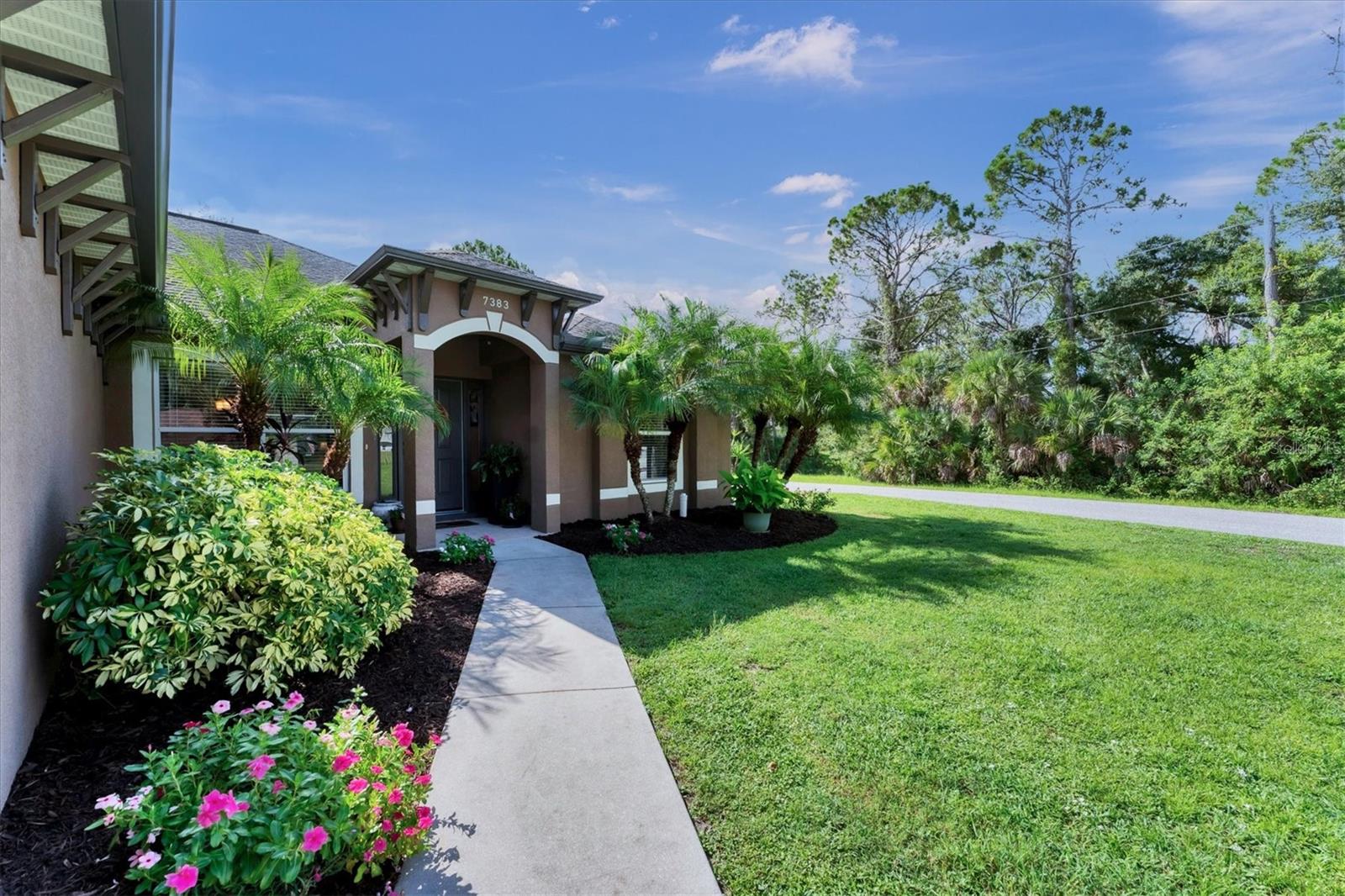 Perfect floor plan with ample living space for your family or entertaining! This AMAZING POOL home is beautifully landscaped on a CORNER LOT and features 3 bedrooms, 2 bathrooms, an ABSOLUTELY BEAUTIFUL light and bright kitchen with a breakfast nook and Island that opens to the spacious FAMILY ROOM, with the pool and Lanai’s outdoor areas just beyond that.
The desirable layout includes a tranquil and private PRIMARY SUITE with a walk-in closet, soaking tub, separate shower, private water closet and dual sinks on one side, 2 guest bedrooms and bathroom on the opposite side of the home. The home also features an indoor laundry room, and office. As you enter this stunning home you are greeted by a dining and living room leading to the outdoor space offering privacy and a wooded backdrop. Kitchen and baths have granite countertops, tiled floors, living areas have BEAUTIFUL hardwood floors.
The homeowners own the lot behind the home and have no desire to build on it. They have NOT filed any insurance claims and have NOT had any damage from the hurricanes or storms. 7383 W Cameo Cir. is high and dry and in an X FLOOD ZONE. Insurance is with Towerhill, Roof is 17 years, A/C is 7 years, newer garage door motor, Plyox hurricane clips and boards, hurricane rods for garage door that mount into the concrete floor and header. See the attached complete list of improvements. This home has been well cared for and meticulously maintained!
This is a must see. CALL TODAY!