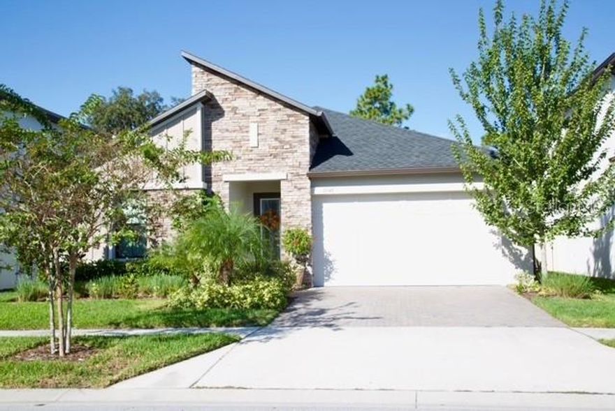 Welcome to this stunning pool home, perfectly located in one of the most desirable and convenient areas of Land O’ Lakes. Dive into your own oversized private heated salt generated chlorine pool, complete with water bubblers features, extra decking, LED lighting, and a durable screened enclosure—all overlooking breathtaking sunsets and a peaceful conservation backdrop. The home is surrounded by beautifully upgraded landscaping and features a full irrigation system in both the front and back yards.

This gorgeous three-bedroom, three-bath home with an office offers a smart, functional layout that feels both open and inviting. As you enter, you’re welcomed by a spacious bedroom with its own private bathroom, followed by wide hallways enhanced with modern upgraded lighting and elegant crown molding. The open office with French doors provides a perfect space for work or study, while the main living area opens up to a bright and airy great room seamlessly connecting the living, dining, and kitchen spaces.

The kitchen is a true showpiece, featuring a large island with beautiful finishes, stainless steel appliances, a built-in microwave and thermal wall oven, a modern stainless-steel exhaust fan, and a convenient kitchen water filter. The open-concept design is perfect for entertaining family and friends, while the spacious living areas are adorned with stylish ceiling fans and high-quality finishes throughout.
The master suite is a luxurious retreat with dual sinks, an oversized walk-in shower, and ample closet space. Each of the three bedrooms offers a functional layout and generous storage, ensuring comfort for every member of the household. Energy-efficient dual-pane windows provide peace of mind and long-term savings.

Living in Connerton means you’ll enjoy resort-style amenities, including walking trails, a state-of-the-art fitness center, tennis and pickleball courts, a clubhouse, and a variety of community events and activities for all ages. With top-rated schools nearby and every convenience just minutes away, this location truly has it all.

Why wait for new construction when this fully upgraded, move-in-ready home is waiting for you? Save time and money on post-purchase improvements and come see for yourself why this Land O’ Lakes gem is the perfect place to call home.