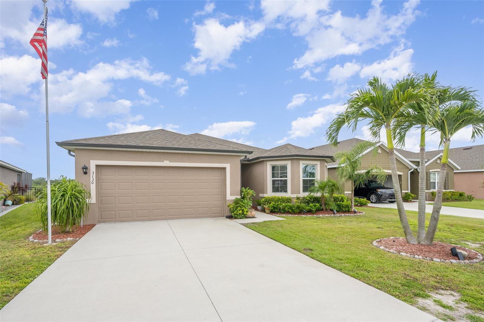 Step into modern comfort with this stunning 3-bedroom, 2-bathroom single-family home in Mims, FL, built in 2023 and offering 1,756 heated square feet of thoughtfully designed living space. Enjoy serene views of the golf course from your fully screened outdoor area, complete with a relaxing spa—perfect for unwinding or entertaining. This like-new home features outstanding upgrades including beautiful wood flooring throughout, a convenient dog run, a long driveway, and a spacious 2-car garage. The bright, open layout and quality finishes make everyday living a breeze. Best of all, residents enjoy free golf access, making this home a golfer’s dream! Don't miss the chance to live in a beautiful setting with resort-style perks right at your doorstep.