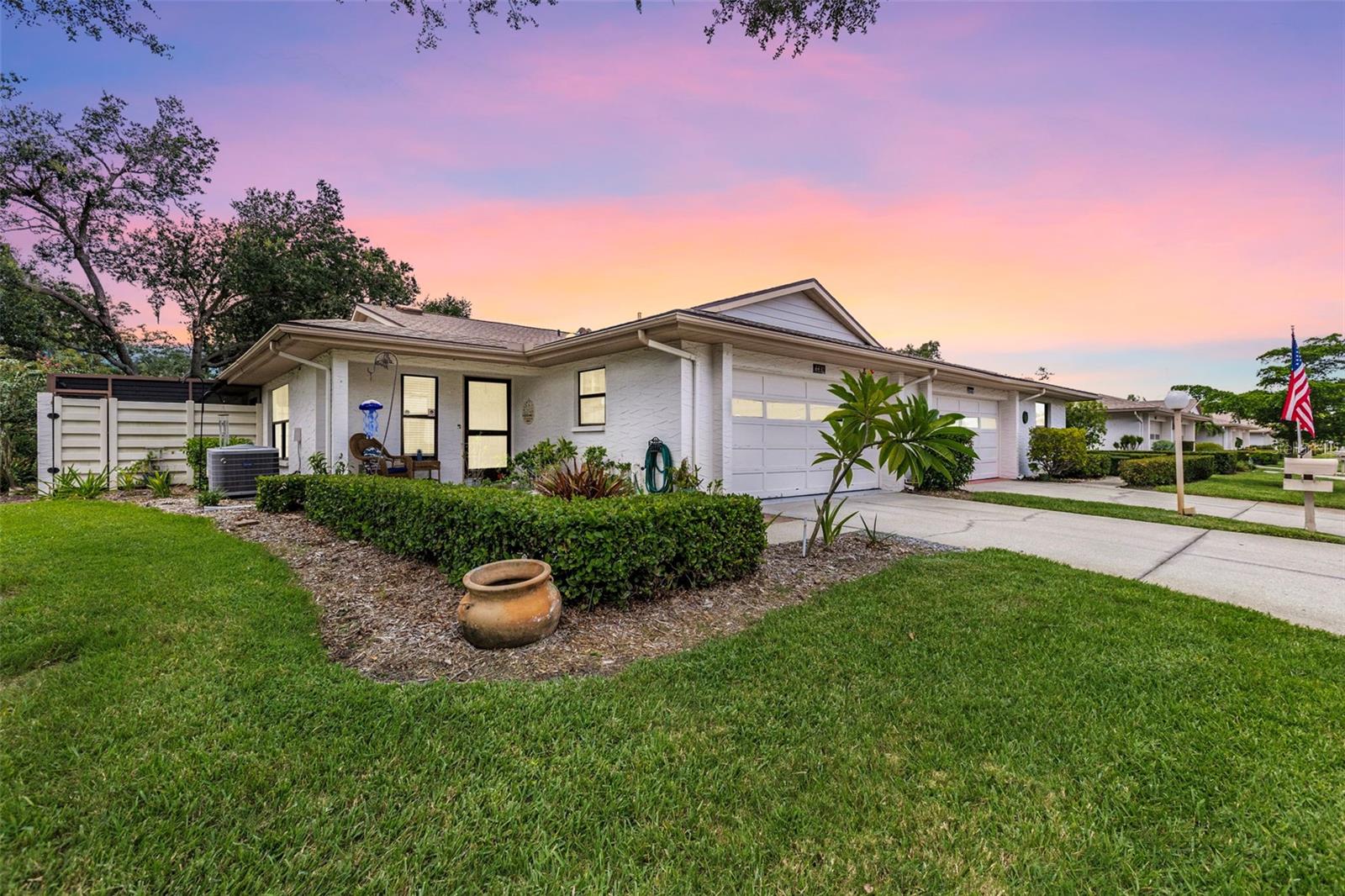 Start your mornings with coffee in your private screened courtyard, spend your afternoons at the beach, and return home to the comfort of this beautifully updated villa in Sarasota’s sought-after 55+ community of Center Gate Estate Villas. This 2-bedroom, 2-bath home with a 2-car garage offers vaulted ceilings, a bright open layout, and a kitchen with granite countertops, rich wood cabinetry, stainless steel appliances, and a breakfast bar that flows into the living and dining spaces. A single skylight fills the main living area with natural light, while the enclosed Florida room offers year-round enjoyment. The spacious primary suite features a walk-in closet and remodeled bath with a walk-in shower, while the guest bedroom and updated guest bath are perfect for visitors. Major updates include a 2022 roof, new flooring throughout, fresh interior paint, new ductwork, upgraded electrical panel, updated lighting and fans, and added garage cabinetry. Enjoy maintenance-free living with access to a sparkling community pool and beautifully landscaped grounds, all minutes from shopping, dining, medical facilities, I-75, and Siesta Key Beach. **THIS PROPERTY QUALIFIES FOR A 1% LENDER INCENTIVE IF USING PREFERRED LENDER. INQUIRE FOR MORE DETAILS.**