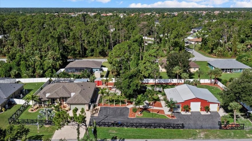 THE BEST VALUE IN NORTH PORT FLORIDA! Spacious pool home with land, detached workshop, and luxury upgrades. NO HOA and a private guest apartment with bath in the detached garage. This stunning North Port property sits on 0.69 acres (three lots) and offers 2,130 square feet of open-concept living space with 2 bedrooms, 2 bathrooms, and exceptional Florida lifestyle features.

Step inside to elegant porcelain plank tile flooring, vaulted ceilings, and a bright, open design that connects the updated kitchen, dining area, and living room. The kitchen includes granite countertops, stainless steel appliances, soft-close cabinetry, and a designer backsplash. The large bonus or game room is perfect for entertaining family and friends.

The primary suite is a true retreat with dual walk-in closets, direct pool access, and a spa-style bathroom with a walk-in shower and soaking tub. Relax outdoors on your private screened lanai featuring a sparkling in-ground pool, accent lighting, and tropical landscaping.

The 40’ x 50’ detached garage and workshop is a dream for car enthusiasts, RV owners, or business use. It includes air conditioning, epoxy floors, an office or in-law apartment with a full bathroom, and room for up to six vehicles, boats, or trailers.

Additional upgrades include a 2023 roof, newer A/C, reverse osmosis system, fenced yard, irrigation system, and charming farmhouse-style finishes.

Located in North Port near Wellen Park, Venice, Port Charlotte, Gulf Coast beaches, Warm Mineral Springs, and I-75. This rare property offers the perfect blend of privacy, luxury, and functionality, ideal for anyone seeking a Florida pool home with acreage, workshop, and no HOA fees.

Schedule your private showing today!