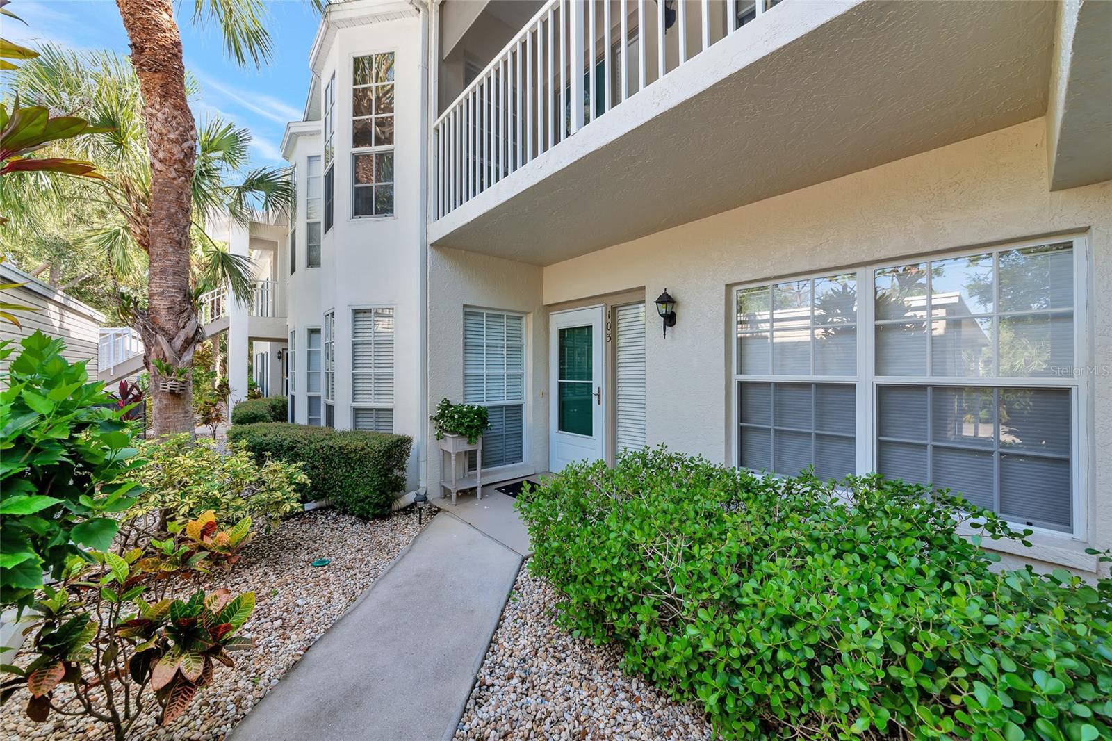 Welcome to your dream home in the heart of Venice! This beautifully maintained, first-floor condo in the highly sought-after Waterside Village community offers breathtaking, long lake views and a low-maintenance lifestyle in one of the most social and welcoming neighborhoods around. Step inside this move-in-ready residence, where you'll find 2 spacious bedrooms, 2 full bathrooms, and an airy, thoughtfully designed layout that combines comfort with elegance. Recent updates and tasteful finishes give this home a fresh, coastal vibe for true Florida living. This condo has been enhanced with engineered hardwood flooring throughout, fresh interior paint, newer window treatments, and a hard-wired surge protection system. The upgraded kitchen is a chef’s delight, featuring ample cabinetry, matching appliances, two pantries, a built-in desk, a large breakfast bar, and a bright breakfast nook. Whether you’re hosting or enjoying a quiet cup of coffee, this space is both functional and inviting. The open-concept living and dining areas offers plenty of space for hosting gatherings or simply enjoying everyday comfort. Just beyond, the light-filled Florida room is sure to become your favorite place to unwind, perfect for quiet mornings, birdwatching, or taking in the serene lake views. The primary suite offers stunning lake views off the private lanai entrance, a generous walk-in closet, and an en-suite bathroom with dual vanities and a massive walk-in shower. The guest bedroom is equally spacious and secluded, ideal for overnight visitors, an at-home office, hobby room, workout space, and more! Step outside to the extended patio, a prime spot to relax under the Florida sun and soak in the tranquility of your surroundings. Framed by swaying palm trees and vibrant tropical landscaping, this serene outdoor space offers a stunning view of the pristine lake beyond a picturesque setting to watch many sunsets, entertain guests, or simply enjoy the beauty of nature at your doorstep. An interior laundry room adds to the convenience, and there’s additional storage space for beach chairs, bikes, or seasonal decor. A designated carport and ample guest parking make visits easy and enjoyable. Waterside Village is known for its active and friendly atmosphere, with amenities that include three heated pools, tennis and pickleball courts, shuffleboard, bocce ball, a clubhouse, and a wide variety of social activities, from card games and fitness classes to book clubs and community luncheons. The low monthly condo fee covers nearly everything, including exterior maintenance, landscaping, water, sewer, trash, cable, pest control, building insurance, and even roof replacement. Centrally located, this condo is just minutes from Venice Island’s beaches, charming shops, and restaurants. You’ll also find grocery stores, top schools, medical facilities and access to commuter routes all close by. If you’ve been dreaming of a peaceful, maintenance-free Florida lifestyle in a vibrant community, this is your chance. Schedule your tour today before this little slice of paradise is gone!