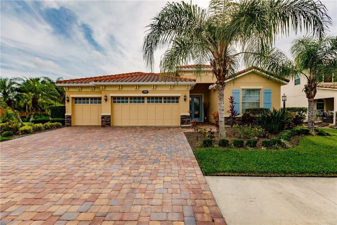 Welcome to this highly sought-after gated community of Red Hawk Preserve! This property is situated on a large, corner lot with a beautiful tropical garden in a very private setting. This 4 bedroom, 3.5 bathrooms, 3 car garage, pool home is designed with a timeless elegance and neutral yet modern flow that goes through every room. Upgraded features include glass impact resistant entry door, soaring 9' ceilings with lighted fans and trays, 8’ doors, oversize windows with roll down window treatments, gorgeous newer lighting and fixtures, collapsing sliding doors for outdoor living space, wood plank tile in bedrooms, huge laundry room, quartz countertops, wireless security system, full water softener system, whole house solar system, and the list goes on. The gourmet kitchen offers soft close cabinets, turkish backsplash, under cabinet lighting, built in convection oven combo, and stainless steel appliances. The oversized 3 car garage offers tons of additional space and storage with garage refrigerator included. The oversized lanai includes an abundance of privacy with a large pool, waterfall feature, storage closet, and an additional half bathroom. This property is a must see. Red Hawk Reserve is a popular, gated, family community comprised of only 148 homes. Low HOA Fees, No CDD. Conveniently located close to A+ Rated Schools, hospitals, parks, shopping, dining, entertainment, Siesta Key Beach, the UTC Mall, and Downtown Lakewood Ranch. The location cannot be beat. This opportunity will not last long, call and schedule your private showing today.