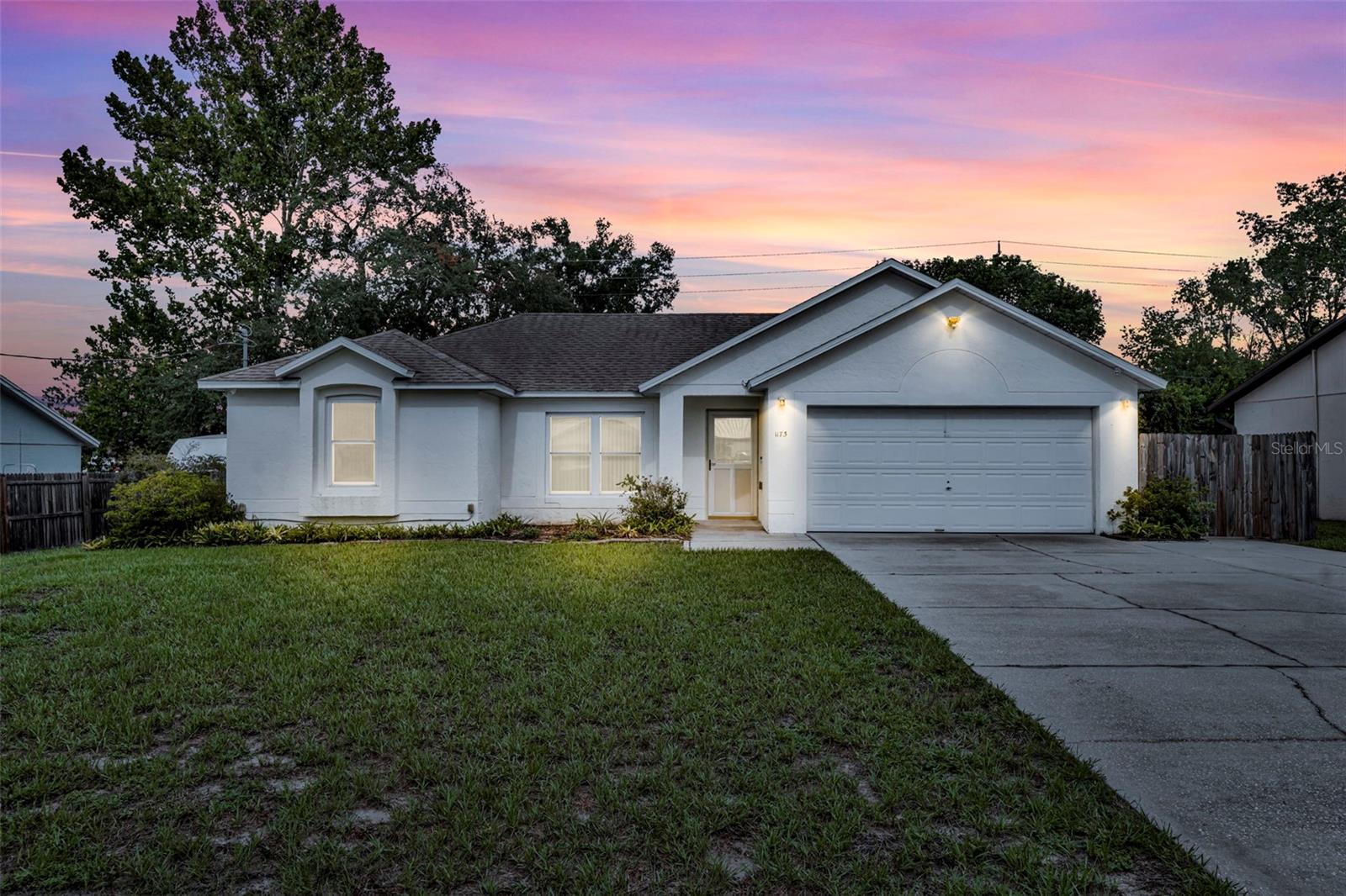 This well-maintained concrete block (CB) construction home features a desirable split-bedroom floor plan with 3 spacious bedrooms, 2 full baths, and a 2-car garage. Enjoy multiple living areas, including a formal living room, family room, and a large kitchen dinette perfect for gatherings. The updated kitchen boasts granite countertops, a pantry, and tile floors that extend throughout the home for easy maintenance.
The primary suite is a true retreat with a generous bathroom offering a walk-in shower, and a walk-in jetted tub. Step outside to a screened porch that overlooks a beautifully landscaped, park-like backyard — ideal for relaxing or entertaining.
Additional highlights include an inside laundry room, ample storage, and a serene, private setting that feels like your own oasis.