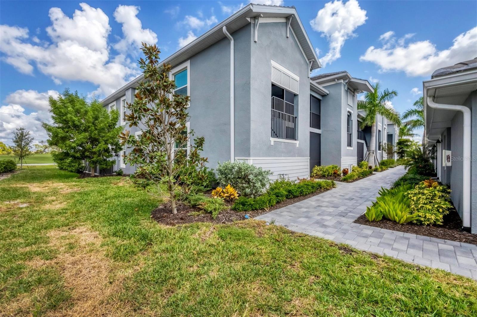 Welcome to Wellen Park Golf & Country Club! This practically brand-new condo offers an exceptional lifestyle with TWO GOLF MEMBERSHIPS INCLUDED! Overlooking the 4th green, this beautifully designed home features 2 bedrooms plus a den, 2 baths, tile floors throughout, 9' foot ceilings, and a bright open kitchen with a center island, and stylish white cabinetry with modern finishes. Enjoy Florida living at its finest with a screened front porch, and rear lanai, perfect for relaxing or entertaining while taking in the outstanding golf course views. Also included is a one-car garage that provides convenient parking and storage. Located in the heart of Wellen Park, enjoy the Wellen Park Downtown area with its excellent restaurants, outdoor concerts, shops, and year round community activities. Wellen Park is also home to Cool Today Park where the Atlanta Braves have their spring training facility. Bocce ball, pickleball, and tennis courts are just a few of the amenities in Wellen Park Golf & Country Club.. A full Fitness Center includes a spa for massages. Enjoy delicious food and drinks at the TIKI Bar. A Clubhouse with a Grille Room and Formal Dining Room will be coming soon. Whether you're a golfer, a social butterfly, or simply looking for an easy-care home in a vibrant setting, this condo checks every box. Don't miss your chance to live where every day feels like a vacation!