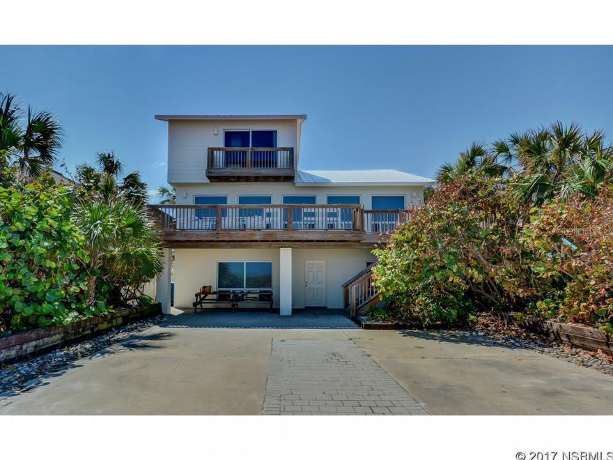 The perfect family retreat on a double oceanfront lot uniquely positioned between S Atlantic and A1A in Bethune Beach. The first floor offers a tiled family room with full bath, his & her bunkrooms and a large mud/laundry room. The second level boasts an oceanfront great room beautifully designed by Wolfe-Rizor Interiors.  The updated kitchen with stainless steel appliances and solid surface counters has lovely views of both the ocean and pool.  This level also has a spacious deck with panoramic views  of the pristine no drive beach and the Atlantic Ocean.  Off the great room is a guest room and full bath overlooking the back courtyard and pool.  The third floor master retreat has spectacular ocean views from a private balcony, walk-in closet and marble bath.  Opposite the pool from the main house is a 2 car garage accessible from A1A and a 400 square foot guest house with kitchenette and full bath. Your guests can wake up to views of the lush tropical courtyard, pool and main house. Please contact us for a private showing of this one of a kind oceanfront home. ;Water: City