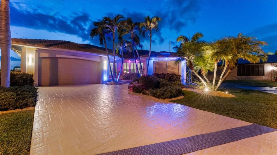 Your Waterfront Sunset View Dream Home in the Prestigious Sailboat Section of Punta Gorda Isles

Step into a rare opportunity where luxury, privacy, and breathtaking waterfront living converge. From the moment you arrive, you’ll sense that this is more than a home — it’s a lifestyle reserved for those who appreciate the extraordinary. 

Perfectly positioned in the highly sought-after sailboat section of Punta Gorda Isles, this exceptional key lot waterfront estate boasts 140' feet of reinforced seawall and expansive, unobstructed wide basin and long-canal views. Each evening, the sky transforms into a masterpiece of vivid sunsets, while tranquil moonlit waters create an ambiance of pure serenity.

The impeccably renovated 3-bedroom, 3-bath residence showcases a sophisticated open-concept design, enhanced by walls of hurricane-impact sliding glass doors that create a seamless flow between indoor and outdoor living. A comprehensive remodel and new roof elevate the home with a refined, modern organic aesthetic, while natural light fills the interior capturing stunning water views from nearly every angle. 

Designed for a truly elevated lifestyle, the outdoor setting is anchored by a brand-new saltwater infinity-edge pool and spa with sun shelf, finished with glass pebble surfaces for a striking, resort-quality feel. Intended for both relaxation and entertaining, the outdoor living space rivals that of a private resort.  Refine your putting skills on your own 5-hole green, or host unforgettable gatherings in the expansive outdoor kitchen overlooking the water. This oversized key lot also offers ample space for extended covered lanais and features a substantial concrete dock, ready to accommodate your custom boating setup. 

Inside, the home continues to impress with an incredible chef’s kitchen featuring high-end finishes and a beautifully designed primary suite with a spa-inspired ensuite bath, creating a private retreat of comfort and sophistication. Bonus features of this home include, large walk in pantry, coffee station, back lit onyx waterfall island, fireplace feature wall, extensive landscape lighting, automated lighting throughout, automated blinds and an epoxy-finished garage floor all adding a distinctive touch.

With direct, no-bridge sailboat access, you’re just minutes from the open waters of Charlotte Harbor and the Gulf of America — a true boater’s paradise. Nearby, downtown Punta Gorda offers an array of waterfront dining, boutique shopping, and cultural experiences, all within a charming, vibrant coastal setting.

Meticulously updated and exceptionally positioned, this property delivers the ultimate Southwest Florida lifestyle — where luxury meets tranquility and every day feels like a getaway.

If you’ve been waiting for a signature waterfront property that truly stands apart, this is your moment. Boardwalk and Park Place available!

Schedule your private showing today and experience it for yourself.