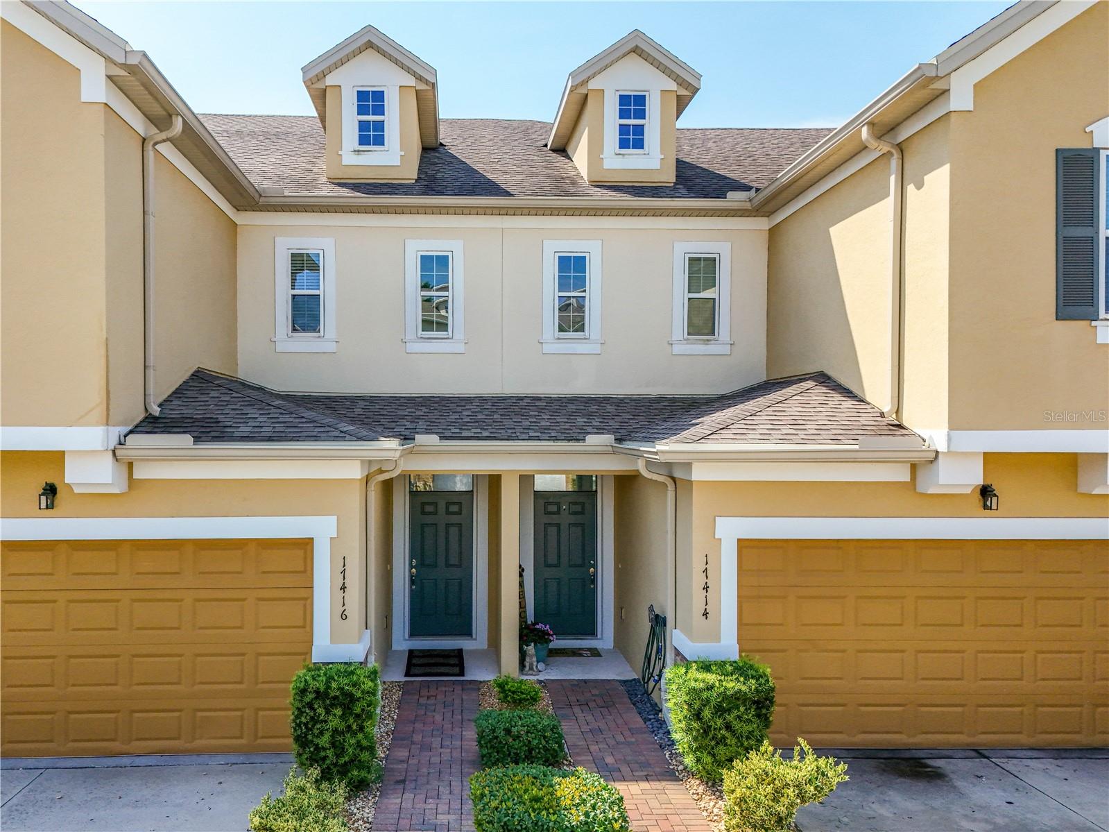 Beautiful townhome in the gorgeous lakefront community of Magnolia Pointe. This townhome is an organized buyer's dream. From the custom closets to the pull-out storage for pots and pans, to the added storage in the ceiling of the garage, and to the extra storage in the laundry room, it literally has it all. No detail has been missed in this unit. It's completely move in ready down to every well-planned attribute. The sellers have thought of everything and will remove the stress of moving for the pickiest of buyers. The kitchen boasts rich espresso cabinets and granite counters with lovely new stainless-steel appliances and even includes a double convection oven. There is a convenient bar in the kitchen for extra seating. They have renovated the half bath in the kitchen to a walk-in oversized pantry. The buyer will be able to choose whether to leave it as a pantry or the seller will happily return it back to a half bath. The pull-out storage shelves, pan storage, spice rack and soft close cabinets in the kitchen make for a chef's paradise. The bathrooms have dual sinks and all new hardware and faucets and decorative mirrors and lighting. Everything has been updated, including the additional shelves and vanities above the toilets. All the ceiling fans (all on remote), doorknobs, plugs and outlet covers, and lighting fixtures have been upgraded as well. The water heater is new, and the air handler of the AC was recently replaced and under warranty. The living room has an elegant accent wall for the TV, and it also leads to the very private and comfortable screened in lanai. The luxury vinyl plank flooring gives a very stylish feel in the primary bedroom downstairs as well as the entire upstairs. Upstairs has a lot to offer including a large storage closet not pictured. First you have a very generous open flex space that can be used as a second living room, bonus room, office, etc. There are also 3 sizeable bedrooms with walk in closets upstairs and a very functional laundry room with custom cabinets and shelves and a utility sink, all added by the owner. Did we mention the to die for custom closets? Got extra handbags and shoes? We've got you covered! Wait until you see the extra storage added in the garage? Again, no detail was missed in this home. Magnolia Pointe is a 24-hour manned guard gated community with a community pool, clubhouse, tennis courts, boat ramp, dock, and playground all on the shores of pristine John's Lake. It is conveniently located to the Turnpike, and all that Clermont and downtown Winter Garden has to offer. Expect to be Impressed, See it today, Call it home tomorrow! A MUST SEE!