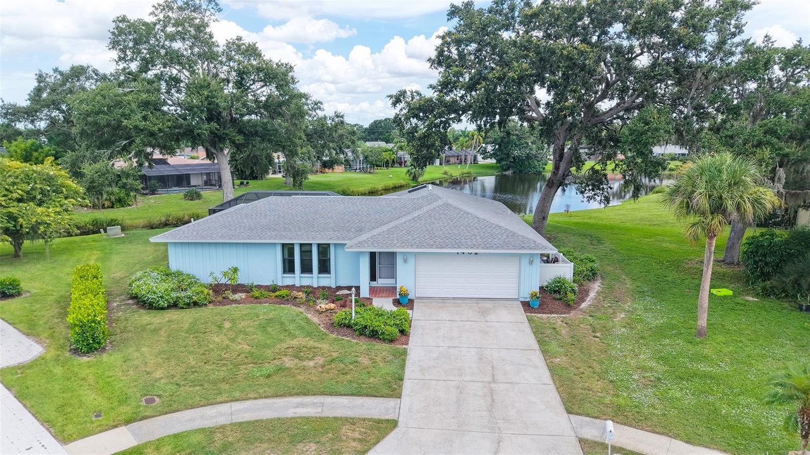 Live the Sarasota lifestyle in this beautifully maintained and charming 3-bedroom, 2-bathroom pool home offering approximately 133 feet of lake frontage in the highly desirable and centrally located Tamaron community. With nearly 1,900 square feet of living space and water views from multiple rooms—including the kitchen—you’ll enjoy a tranquil setting that feels like a private retreat. As an added bonus, this lot is located on a cul-de-sac for an even more private experience.
The split plan layout is well-designed and inviting, and features a mix of tile and engineered wood flooring throughout. A new roof (2021), hurricane-impact windows (not sliders), and a brand-new pool cage (2025) add comfort and peace of mind. Enjoy morning coffee or al fresco dining in the covered outdoor area overlooking the screened-in pool and tranquil lake beyond.
The kitchen has a great view overlooking the pool and lake in the distance. The primary suite has an oversized walk-in closet and pool access with great views as well. There is a large interior utility room with extra storage and the whole home truly has a lovely feel to it.
Tamaron is a centrally located, established Sarasota neighborhood with low HOA fees, sidewalks, and quick access to beaches, downtown, shopping, and dining. Don’t miss this rare opportunity to own a solid lakefront home with lasting value in a prime Sarasota location- schedule your private showing today!