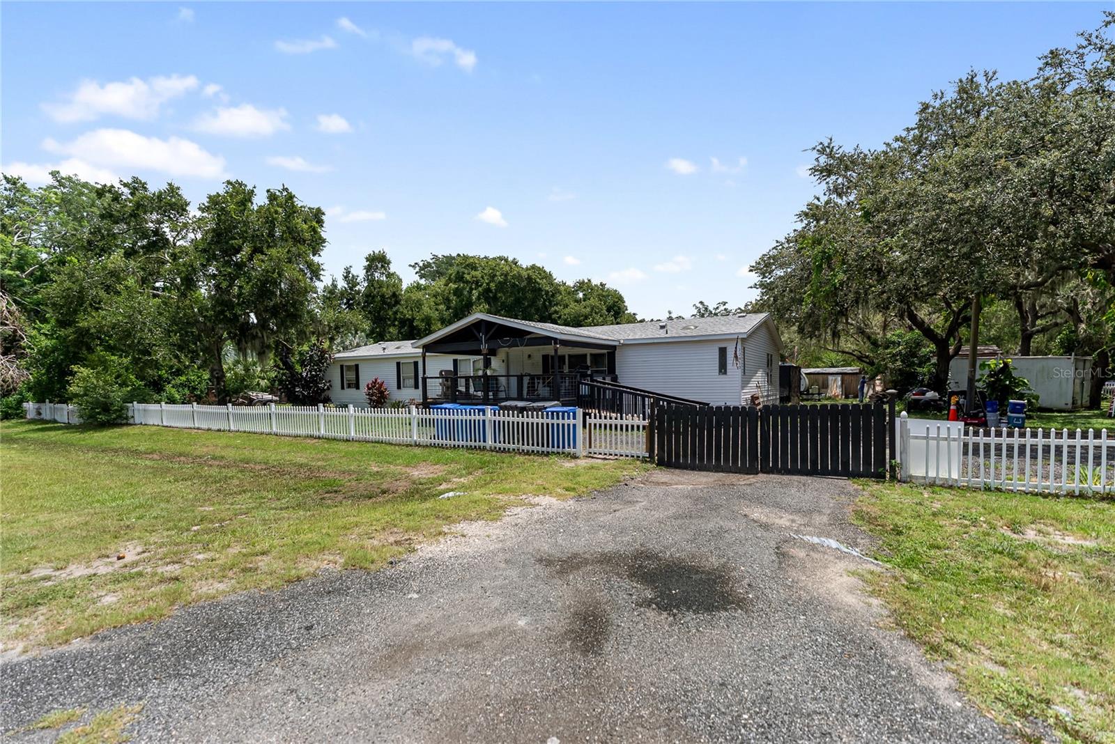 LIVE THE FLORIDA COUNTRY LIFESTYLE in your new dream home!
Nestled in a beautiful country setting with a convenient location and NO HOA, this property is waiting for your personal touch! With plenty of space for your boat, RV, or trailer, the possibilities are endless—create an amazing pool or workshop and truly make it your own!
Step inside to discover LUXURY PLANK FLOORING and an abundance of natural light that highlights the fantastic layout. The UPDATED KITCHEN is a true showstopper, featuring brand NEW shaker cabinets with soft-close drawers, stunning granite countertops, stainless steel appliances, and a skylight. It’s the perfect space for hosting dinner parties or preparing family meals.
The master bedroom offers a serene retreat with a walk-in closet and a luxurious master bathroom, while three additional bedrooms provide comfortable accommodations for family and guests. Transition effortlessly from the spacious interior to your oversized FENCED YARD through the sliding doors—your private oasis awaits!
Enjoy peace of mind with all the major systems in great shape, including a NEWER AC, ensuring confidence in your investment. This home has been updated with love and care, so you can move in and start enjoying your new Florida lifestyle right away.
Don’t miss your chance to own this livestock-friendly property—schedule your showing today! Experience the perfect blend of style, comfort, freedom, and functionality in this exceptional home!