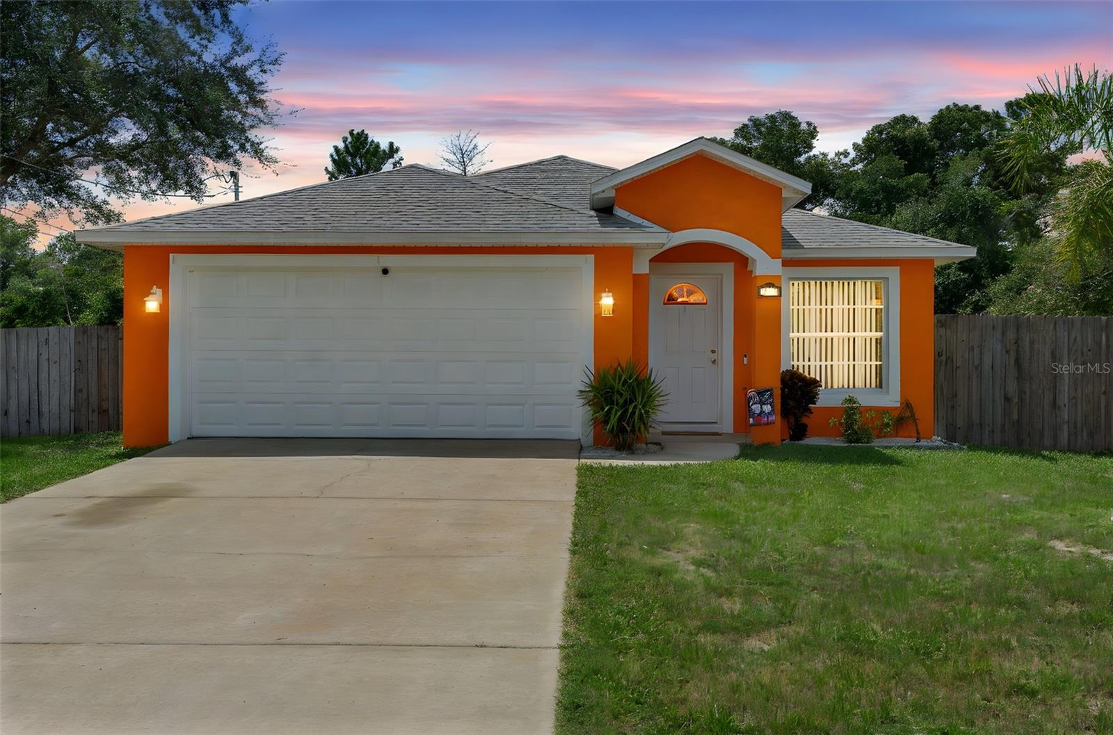This high and dry 3-bedroom, 2-bath concrete block home in excellent condition with a newer roof (2023) and large, fenced backyard with NO HOA is located conveniently in a quiet area between Historic Downtown Deland and Daytona Beach. Inside, the main living area is open to the kitchen and features large tiles that flow throughout much of this beautiful home. The spacious kitchen includes an abundance of counterspace and cabinetry, a reach-in pantry and all appliances. Step out from the kitchen to the private screened patio, perfect for sipping coffee while watching the birds or sunset. The 13’ X 13’ primary bedroom suite includes private access to the screened patio along with an ensuite bath with step-in shower. Additional features include plenty of space on the side of the home for a boat or RV, an indoor laundry room, all new paint (2023), newer water heater (2022), newer fence (2022), newer water filtration system (2022) and the septic was pumped in 2023. Ask your Realtor® for the unbranded virtual tour of this home. All measurements are approximate and should be independently verified.
