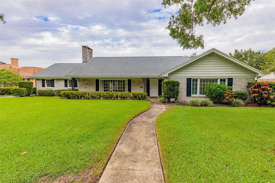 IMMACULATE HOME, TRUE LAKEFRONT ON LAKE MIRROR ON THE CHAIN OF LAKES!!! This three bedroom 2 bath brick home welcomes you with its mature landscaping and stunning curb appeal! Seller says recent improvements include a new roof in March 2019, new HVAC in 2019 & new insulation added in 2019.  Inside you'll find just over 2,800 Sq. Ft. of living space, a sunken formal living room with tons of natural light and a wood-burning fireplace, formal and informal dining spaces, a massive family room that also has a wood-burning fireplace and access to the carport and backyard, and a kitchen perfect for entertaining guests. Your primary suite features lots of closet space and your primary bathroom equipped with dual vanities, a walk-in shower, and a garden tub. Bedrooms two & three are both well-sized & both accessible to the guest bathroom. Throughout the home you'll see carpet, wood, and tile flooring. The bedroom is currently carpeted but has beautiful parquet flooring underneath! In the backyard you'll find your covered 2-car carport, screened-in back patio and pool with additional storage and utility space, irrigation is piped in from the lake, the large fenced-in backyard overlooks Lake Mirror on Winter Haven's famous Chain-of-Lakes! Sitting on one of the prettiest streets in all of Winter Haven, you'll be just minutes away from dining, shopping, medical, LEGOLAND, and Downtown Winter Haven. Don't miss out on this gem, call us today!