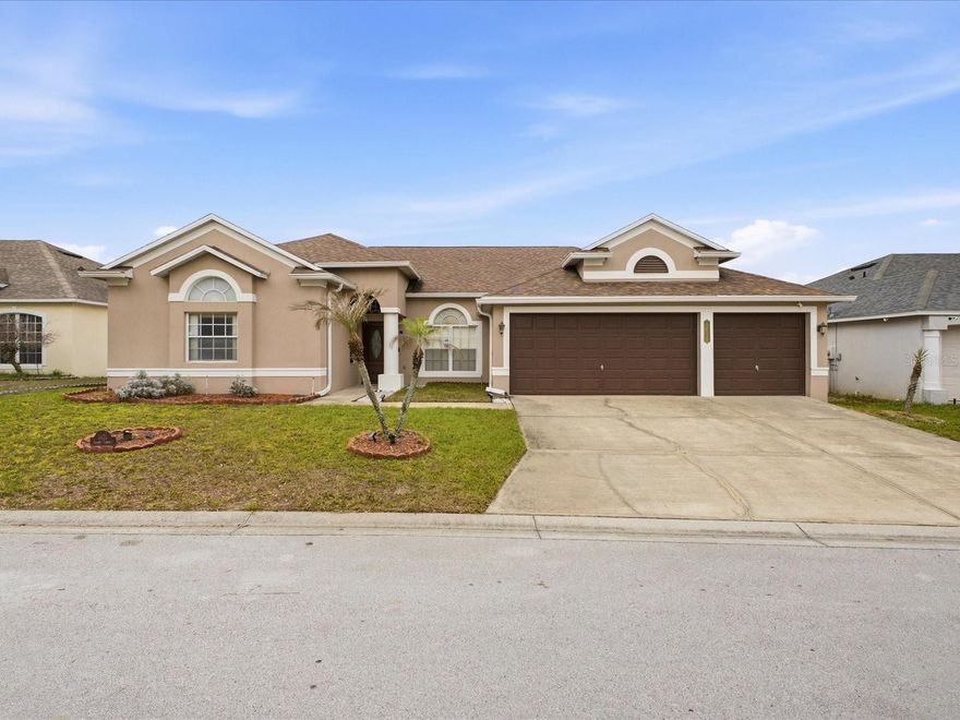 One or more photo(s) has been virtually staged. Welcome to this spacious and beautifully maintained 5 bedroom, 3 bathroom pool home located in the desirable community of Grand Reserve in Davenport with NO CDD PAYMENT AND LOW HOA! This move-in-ready property offers an open and airy split floor plan with soaring ceilings, abundant natural light, elegant rounded wall corners, and expansive living spaces designed for both comfortable living and entertaining. The oversized kitchen features a large center island, abundant cabinet and counter space, stainless steel appliances, and a convenient built-in desk area, all overlooking the spacious living and dining areas. Large sliding glass doors and oversized windows bring in plenty of natural light and showcase the inviting pool area. The primary suite offers direct access to the screened lanai and features a spacious ensuite bathroom complete with dual vanities, a garden tub, separate shower, and walk-in closets. The thoughtfully designed split-bedroom layout provides additional privacy and flexibility for family or guests. Step outside and enjoy your own private Florida retreat featuring a stunning wrap around screened swimming pool and covered lanai perfect for relaxing, entertaining, or enjoying Florida living year-round. Additional highlights include a 3-car garage, indoor laundry room, oversized tile flooring throughout the main living areas, generously sized secondary bedrooms, and neutral modern finishes throughout. Conveniently located near shopping, dining, schools, major highways, and Central Florida attractions, this exceptional property offers space, comfort, and a fantastic layout in a great Davenport location. Schedule your private showing today!.