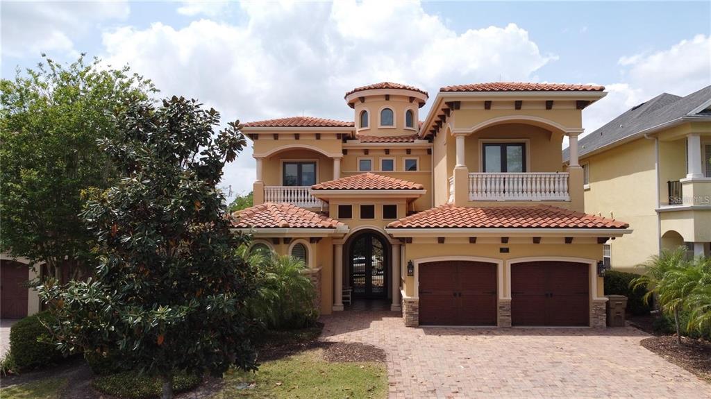 Disney Federal Partner Credit Union offering 4.97 % 5/1 arm with 5 percent down on this Incredible Reunion Estate with mutually agreed upon contract by Mid December 2022. "Jewel Box" home is when someone right-sizes & in this case present owners moved from over 15,000 sq ft into perfect-sized over 5500 sq ft under air, custom designed property where EVERY INCH is EXQUISITE in detail. The attention to detail is beyond any home you will see & is in MINT CONDITION! Never Rented & only utilized 6 months out of the year. Owners are original home owners that have built some of the Most Magnificent properties in all of Central Florida & Saratoga Springs, New York.  They currently still hold the record w/ the highest priced estate sale in the Disney town of Celebration Florida. Sellers viewed Over 50 vacant lots that were considered when Reunion first opened-the panoramic Views to these homeowners were critical - one of the homeowners is an artist & the promise of spectacular Florida sunsets were a MUST. Then the consideration of where golf balls land - the present owners have golf course experience & realize the importance of being far enough from the tee to avoid golf balls in your pool (or worse) & far enough away from the green to not subject yourself to a curse word of two heard from that missed putt. So we START with the best lot & it is on the 10TH fairway of Arnold Palmer Golf Course (by the way you have not one ,but THREE Golf courses in Reunion - a golfer's dream come true & so super close to all the Magic that Disney & Orlando have to offer. Bring in the other super successful spouse that settles for nothing less than the BEST in construction & finishes - Hidden Huge Pantry room, Cantera front doors & custom entry tiles, Busby Custom Cabinetry, First & Second Floor Primary Suites, she hired artisans that spent months hand troweling the wall texture throughout this fine estate - owner is originally from Italy & he explains that the ceiling appointments are JUST AS important as the wall finishes - so Look Up at stunning artistry- it's throughout this entire home -MAXIMIZE your greatest lifestyle experience w/ outdoor seating for 18 individuals or sit quietly as a couple on your oversized balustrade balcony enjoying fine wine from your custom bar that is equipped w/ exotic granite, 7 refrigerators throughout the home, 2 laundry rooms (one up & one down), oversized custom suites & the closet in downstairs primary is every fashion lover's dream! The closet Island is the size of many closets just by itself! - Platinum (not just Gold or Silver) Reunion Membership available for transfer - the outdoor space has special appointments too w/ Arizona sandstone that keeps your feet cool around the pool & custom spa, astroturf versus grass for easy maintenance & a fire pit that sits on top of the waterfall. The sellers even thought to put a retention wall in to better protect property from invasive critters - ceilings that have Island thatched motif to Grand staircase w/ custom-cut spindles providing extra safety worthy of a movie scene - The primary bathroom has the most organized Busby cabinetry & even electrical outlets in the drawers so that hair dryer can be neatly tucked away out of sight & not on the exotic countertops  Such a Treasure to Find both Artistry & Functionality for you & your loved ones to enjoy - 2 ensuite bedrooms on 1st floor & 3 oversized ensuites on 2nd floor w/balcony views - 30 more years available on tile roof.