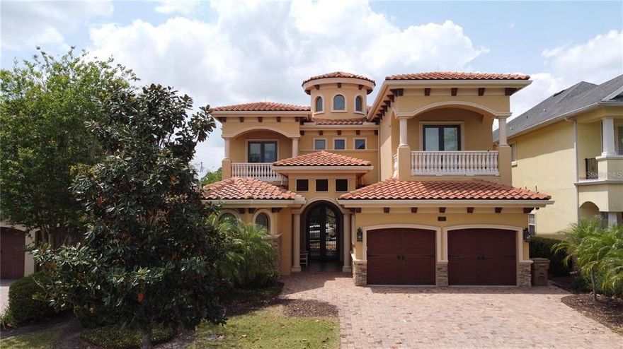 Disney Federal Partner Credit Union offering 4.97 % 5/1 arm with 5 percent down on this Incredible Reunion Estate with mutually agreed upon contract by Mid December 2022. "Jewel Box" home is when someone right-sizes & in this case present owners moved from over 15,000 sq ft into perfect-sized over 5500 sq ft under air, custom designed property where EVERY INCH is EXQUISITE in detail. The attention to detail is beyond any home you will see & is in MINT CONDITION! Never Rented & only utilized 6 months out of the year. Owners are original home owners that have built some of the Most Magnificent properties in all of Central Florida & Saratoga Springs, New York.  They currently still hold the record w/ the highest priced estate sale in the Disney town of Celebration Florida. Sellers viewed Over 50 vacant lots that were considered when Reunion first opened-the panoramic Views to these homeowners were critical - one of the homeowners is an artist & the promise of spectacular Florida sunsets were a MUST. Then the consideration of where golf balls land - the present owners have golf course experience & realize the importance of being far enough from the tee to avoid golf balls in your pool (or worse) & far enough away from the green to not subject yourself to a curse word of two heard from that missed putt. So we START with the best lot & it is on the 10TH fairway of Arnold Palmer Golf Course (by the way you have not one ,but THREE Golf courses in Reunion - a golfer's dream come true & so super close to all the Magic that Disney & Orlando have to offer. Bring in the other super successful spouse that settles for nothing less than the BEST in construction & finishes - Hidden Huge Pantry room, Cantera front doors & custom entry tiles, Busby Custom Cabinetry, First & Second Floor Primary Suites, she hired artisans that spent months hand troweling the wall texture throughout this fine estate - owner is originally from Italy & he explains that the ceiling appointments are JUST AS important as the wall finishes - so Look Up at stunning artistry- it's throughout this entire home -MAXIMIZE your greatest lifestyle experience w/ outdoor seating for 18 individuals or sit quietly as a couple on your oversized balustrade balcony enjoying fine wine from your custom bar that is equipped w/ exotic granite, 7 refrigerators throughout the home, 2 laundry rooms (one up & one down), oversized custom suites & the closet in downstairs primary is every fashion lover's dream! The closet Island is the size of many closets just by itself! - Platinum (not just Gold or Silver) Reunion Membership available for transfer - the outdoor space has special appointments too w/ Arizona sandstone that keeps your feet cool around the pool & custom spa, astroturf versus grass for easy maintenance & a fire pit that sits on top of the waterfall. The sellers even thought to put a retention wall in to better protect property from invasive critters - ceilings that have Island thatched motif to Grand staircase w/ custom-cut spindles providing extra safety worthy of a movie scene - The primary bathroom has the most organized Busby cabinetry & even electrical outlets in the drawers so that hair dryer can be neatly tucked away out of sight & not on the exotic countertops  Such a Treasure to Find both Artistry & Functionality for you & your loved ones to enjoy - 2 ensuite bedrooms on 1st floor & 3 oversized ensuites on 2nd floor w/balcony views - 30 more years available on tile roof.