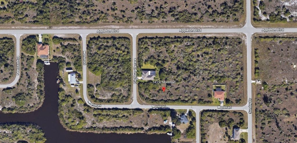 Photo of 14330 Montmarte Avenue, Port Charlotte, FL 33981 (MLS # C7508081)