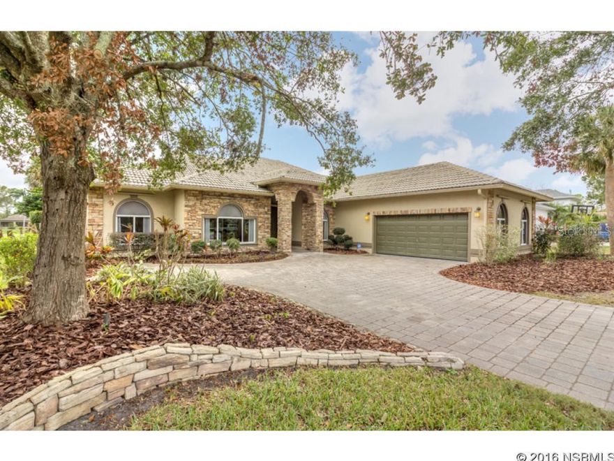 Located in the prestigious Spruce Creek Fly-In Country Club Community this 2,665 Sq Ft home offers real quality craftsmanship throughout. Overlooking  the 15th fairway of the golf Course, this 4 bedroom 3 bath home includes a split plan with open dining room, music room and living room featuring a granite fireplace with custom solid wood design. The kitchen has beautifully crafted cabinets with granite countertops. You will be impressed by the immense vaulted ceilings, marble floors and walls of glass open to a large pool & spa. Plenty of room for family w/ children or a couple. Inside laundry/utility room and a large garage perfect for 2cars plus storage. ;Water: City