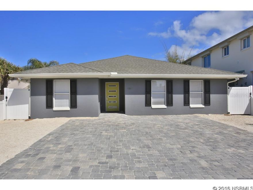 Three houses from the ocean &  ALL NEW EVERYTHING!! This must see 4 bedroom home is in the perfect beachside location.....steps from the ocean AND the first street north of Flagler Avenue.  Owners just finished a total remodel with the nicest finishes and modern style.  All new pavered parking area, low maintenance crushed shell ground cover with mulched area an rear.  Inside, there are four bedrooms with two true master suites.  This allows for some flexibility with the second master, as it has its own easy access  entry door on the east side of home ( in-law suite, rental).  The kitchen.    All New, All Wood, Shaker Style White Cabinets with gorgeous granite , beveled white subway tile , stainless appliances, under cabinet lighting,  single basin stainless sink with every nook and cranny thoughtfully designed for maximum storage.  There is a wonderful inside laundry / walk-in pantry storage just off the kitchen.  There are two bedrooms that share a hall bath and an additional master suite with generous walk-in closet and all new double sink vanity with walk-in shower. Outside , catch the ocean air from the second story deck and have a cozy gathering/ BBQ spot on the lower level.  This home would be perfect  for full time living and entertaining guests OR part time and having a nice rental income due to the desired location! Location! Location!  Call for an easy showing. ;Water: City