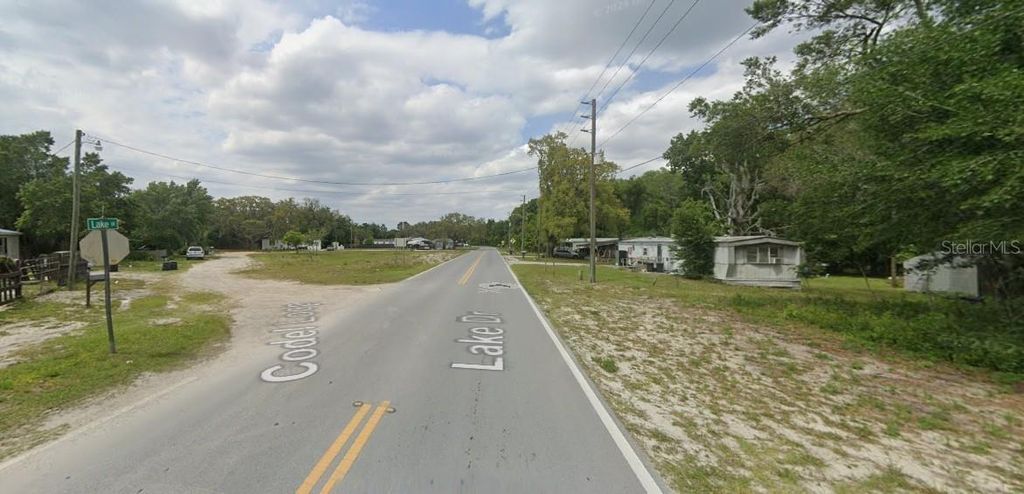 Photo of 9130 Lake Drive, New Port Richey, FL 34654 (MLS # O6392330)