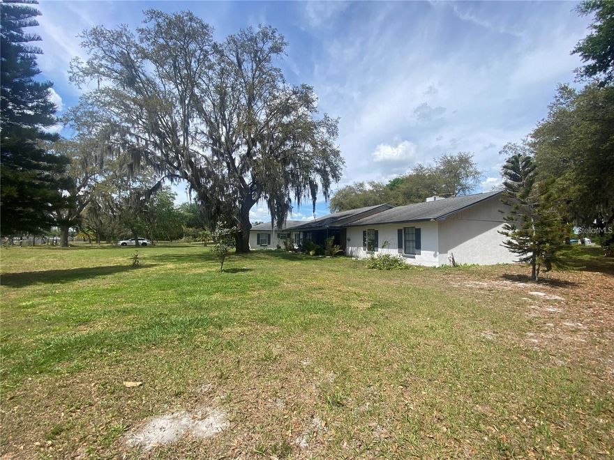 Prime Investment Property! Property sits directly across from the ever-growing Austin Tindall Sports Complex! Prime location for future development! This land will only go up as 2 milestones approach, Land Use Study and Boggy Creek Expansion 2026 Presently zoned agricultural. Osceola County Land Use Study to be completed 08/2025. County  has approved  use to Community Center, allowing restaurant's, shopping centers and so much more! This is one of the fastest-growing communities which has led to the widening of Boggy Creek Road. Centrally located, minutes to Lake Nona, Medical City, 417, Orlando International Airport, downtown Kissimmee, Buenaventura Lakes and St. Cloud. Seller is extremely motivated!
*Home is currently a five bedroom three bath home which includes a 1 bed. 1 bath attached in-law suite with private screen encl. porch. Both homes have private separate kitchens and utility rooms