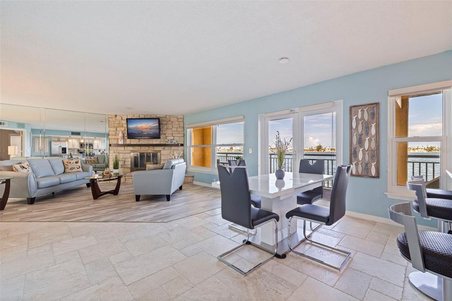 Located in Bluewater Bay on the Island of Tierra Verde, this exceptional CORNER UNIT residence offers the perfect blend of coastal luxury and breathtaking views. Sailboats drift gracefully across the waterways, creating a picture-perfect backdrop from nearly every room. Meticulously maintained, this condo is filled with natural light and features an open floor plan designed for relaxed, elegant living. Beautiful travertine floors, reminiscent of walking on soft sand, stretch throughout the living areas and evoke a true beachside feel.
The kitchen has been tastefully updated with granite countertops and stainless steel appliances, while both bathrooms offer a touch of elegance with matching granite vanities and marble vessel sinks. A newer roof provides added peace of mind, and energy-efficient Stanek windows and doors help keep the home comfortable year-round. Elevated living spaces ensure stress-free, maintenance-free enjoyment without the worry.
Step outside onto your expansive 50-foot covered deck, a rare and inviting feature ideal for entertaining or taking in the spectacular sunsets over the Pass-a-Grille channel. The panoramic views of Shell Island and the sparkling waters of the Gulf create a secluded retreat where tranquility and beauty converge. The living space also includes thoughtful upgrades such as waterproof luxury vinyl flooring and a cozy wood-burning fireplace, adding both comfort and practicality.
Residents enjoy the convenience of an elevator, private garage parking, and an additional assigned parking space. With only nine units in the building, this is a rare opportunity to own a private slice of paradise in a truly boutique waterfront setting. During the holiday season, the lighted boat parade adds to the charm, with front-row views from your own balcony.
This property is being offered furnished and ready for immediate enjoyment. The homeowners association is strong and well-managed, with all structural inspections completed. Have a boat? You're in luck!! Tierra Verde Marina and High & Dry are just a short walk away! They’ll launch and have your boat ready whenever you need it, making your boating lifestyle effortless and convenient. Every detail of this residence has been thoughtfully considered, creating a stunning backdrop for a life of peace, comfort, and timeless coastal living.