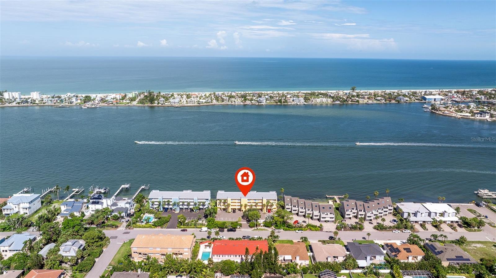 Located in Bluewater Bay on the Island of Tierra Verde, this exceptional CORNER UNIT residence offers the perfect blend of coastal luxury and breathtaking views. Sailboats drift gracefully across the waterways, creating a picture-perfect backdrop from nearly every room. Meticulously maintained, this condo is filled with natural light and features an open floor plan designed for relaxed, elegant living. Beautiful travertine floors, reminiscent of walking on soft sand, stretch throughout the living areas and evoke a true beachside feel.
The kitchen has been tastefully updated with granite countertops and stainless steel appliances, while both bathrooms offer a touch of elegance with matching granite vanities and marble vessel sinks. A newer roof provides added peace of mind, and energy-efficient Stanek windows and doors help keep the home comfortable year-round. Elevated living spaces ensure stress-free, maintenance-free enjoyment without the worry.
Step outside onto your expansive 50-foot covered deck, a rare and inviting feature ideal for entertaining or taking in the spectacular sunsets over the Pass-a-Grille channel. The panoramic views of Shell Island and the sparkling waters of the Gulf create a secluded retreat where tranquility and beauty converge. The living space also includes thoughtful upgrades such as waterproof luxury vinyl flooring and a cozy wood-burning fireplace, adding both comfort and practicality.
Residents enjoy the convenience of an elevator, private garage parking, and an additional assigned parking space. With only nine units in the building, this is a rare opportunity to own a private slice of paradise in a truly boutique waterfront setting. During the holiday season, the lighted boat parade adds to the charm, with front-row views from your own balcony.
This property is being offered furnished and ready for immediate enjoyment. The homeowners association is strong and well-managed, with all structural inspections completed. Have a boat? You're in luck!! Tierra Verde Marina and High & Dry are just a short walk away! They’ll launch and have your boat ready whenever you need it, making your boating lifestyle effortless and convenient. Every detail of this residence has been thoughtfully considered, creating a stunning backdrop for a life of peace, comfort, and timeless coastal living.
